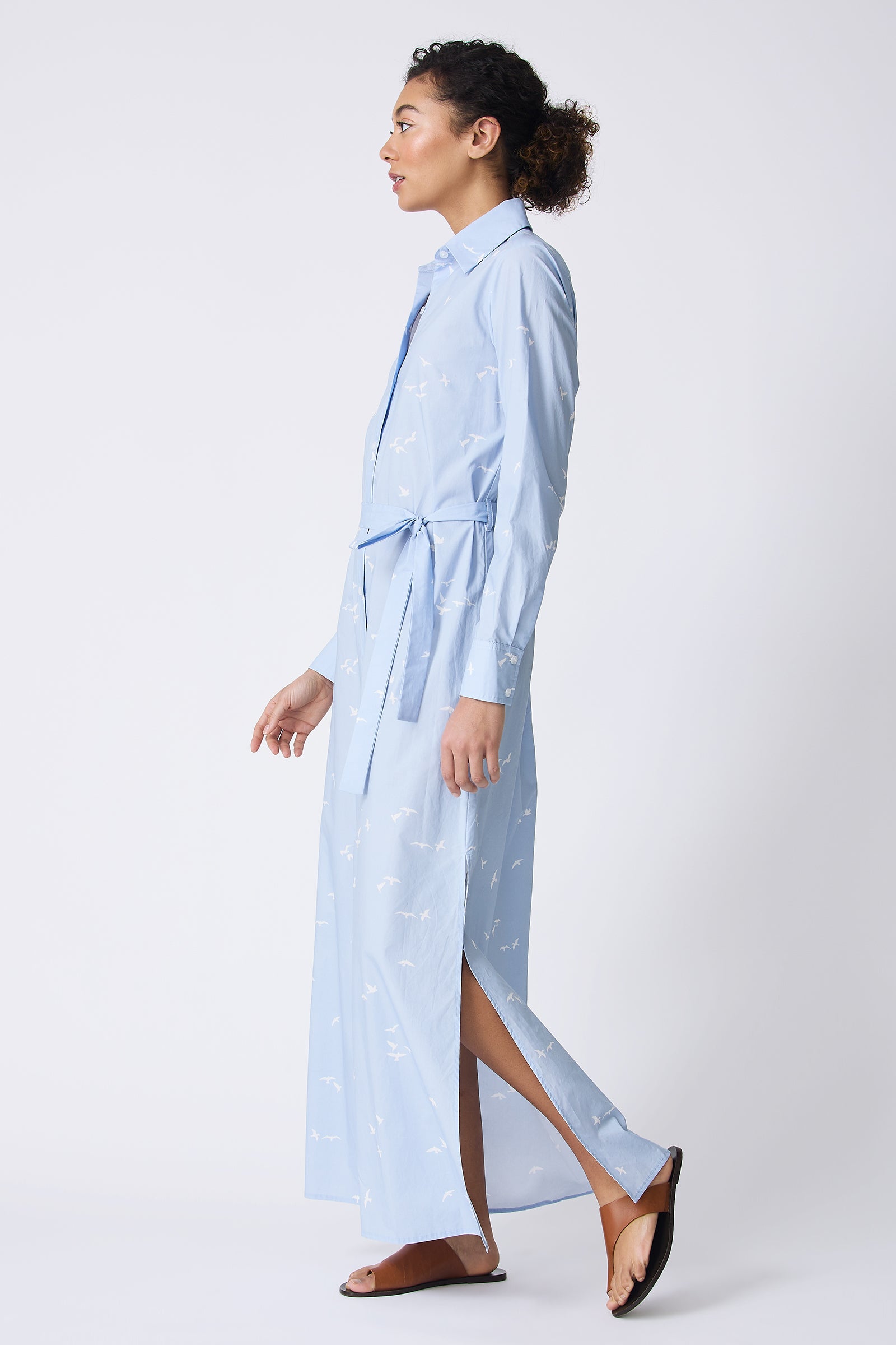 Kal Rieman June Maxi Dress in Oxford Blue Bird Print on model walking side view