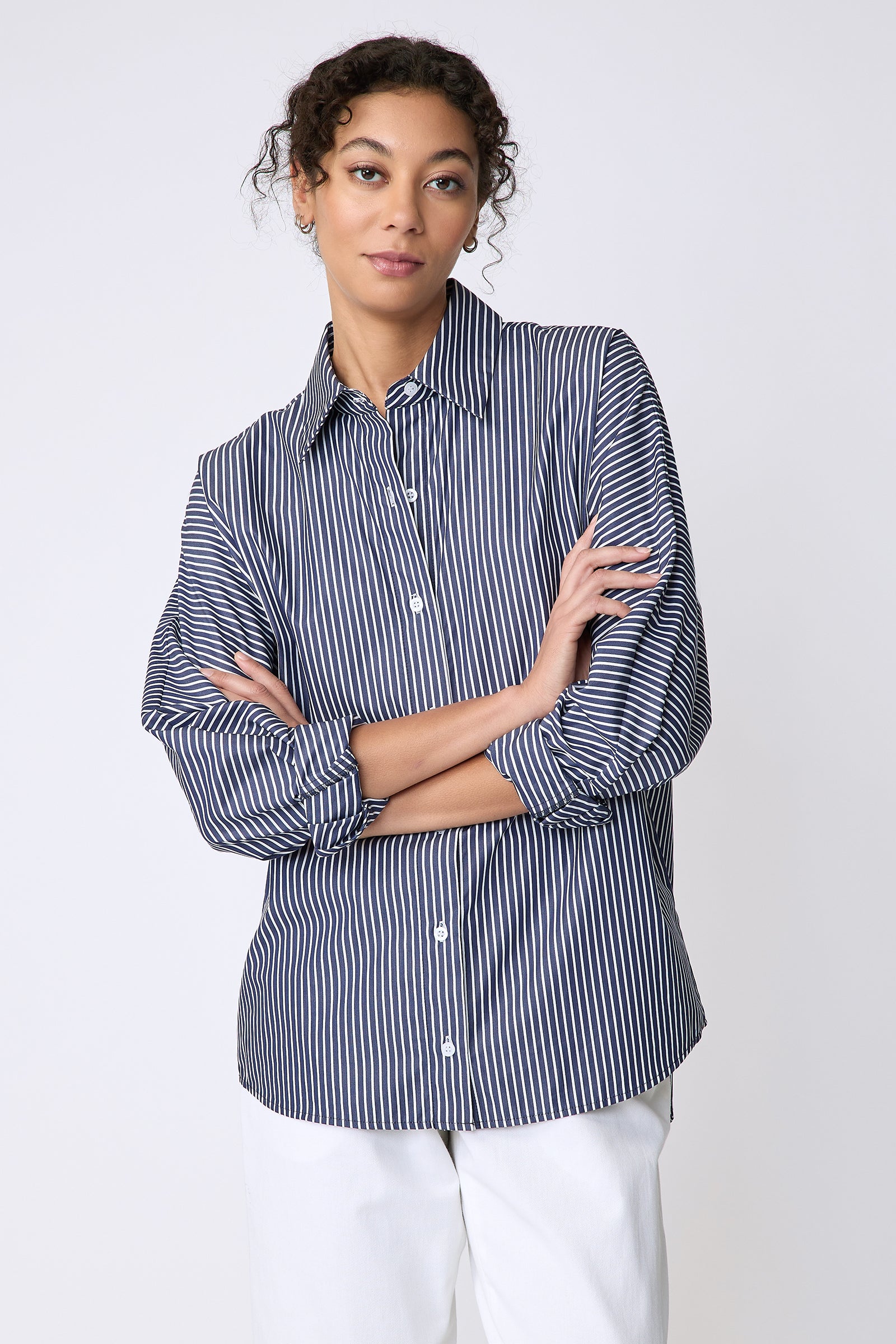 Kal Rieman Lauren Blouse in savoy stripe on model front view arms crossed