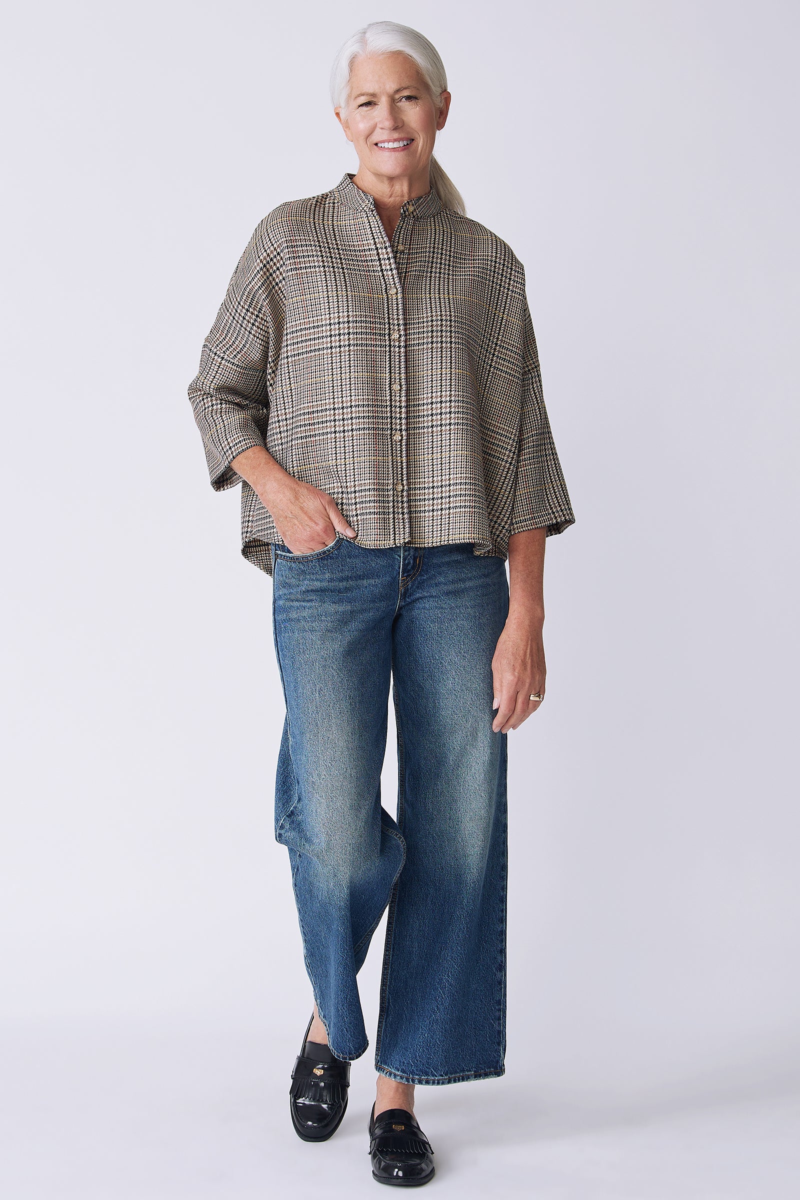 Kal Rieman Lilly Drop Shoulder Top in Plaid on model front view walking