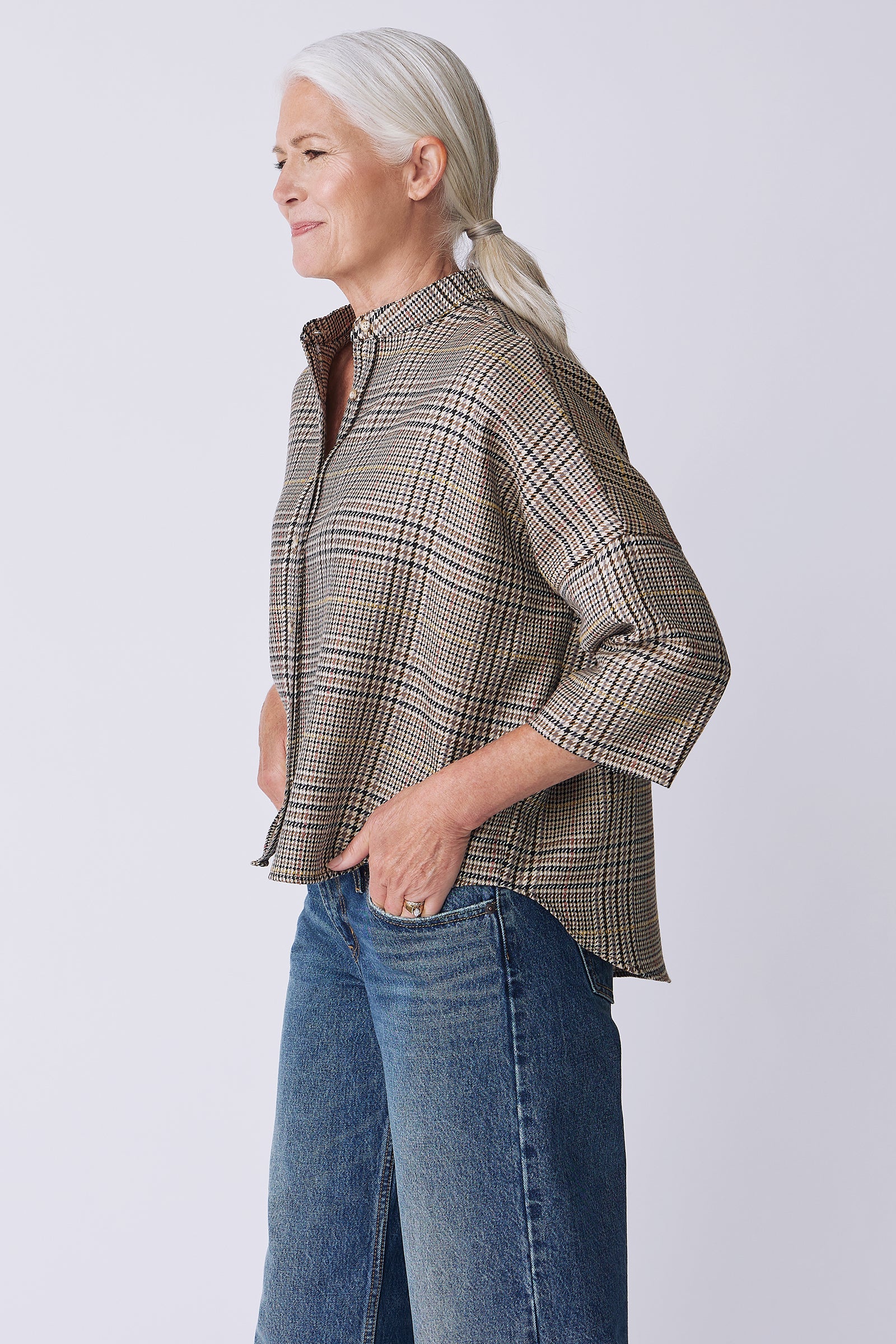 Kal Rieman Lilly Drop Shoulder Top in plaid on model side view hands in pockets