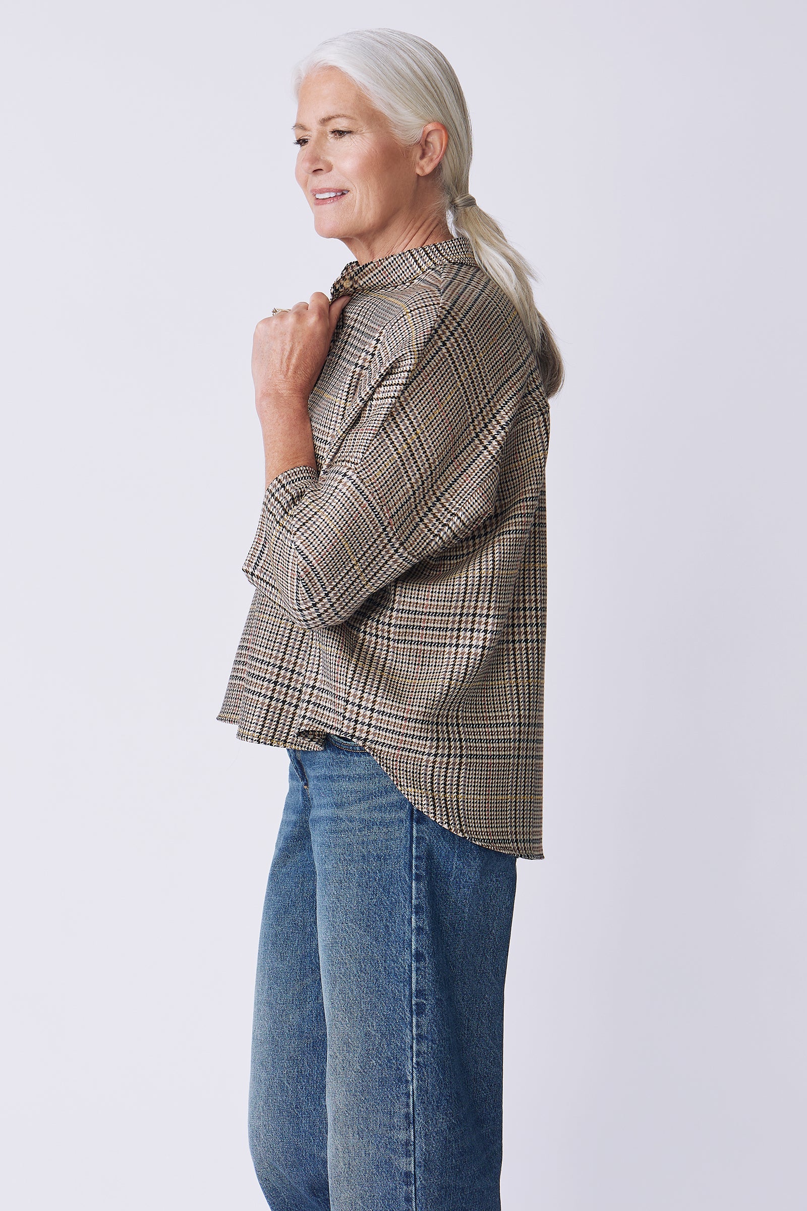 Kal Rieman Lilly Drop Shoulder Top in Plaid on model side view holding collar