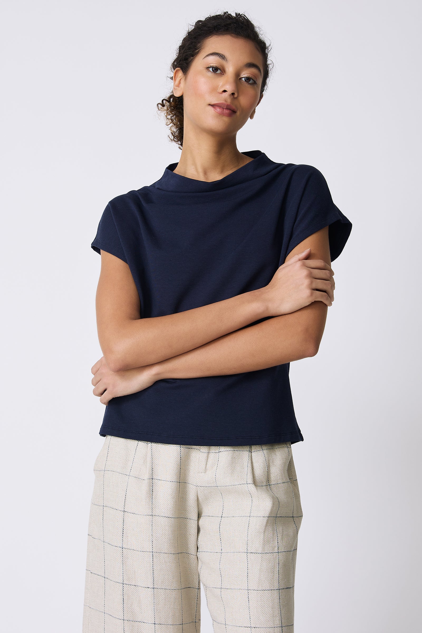 Kal Rieman Luca Cowl Top in Navy on model with arms crossed front view