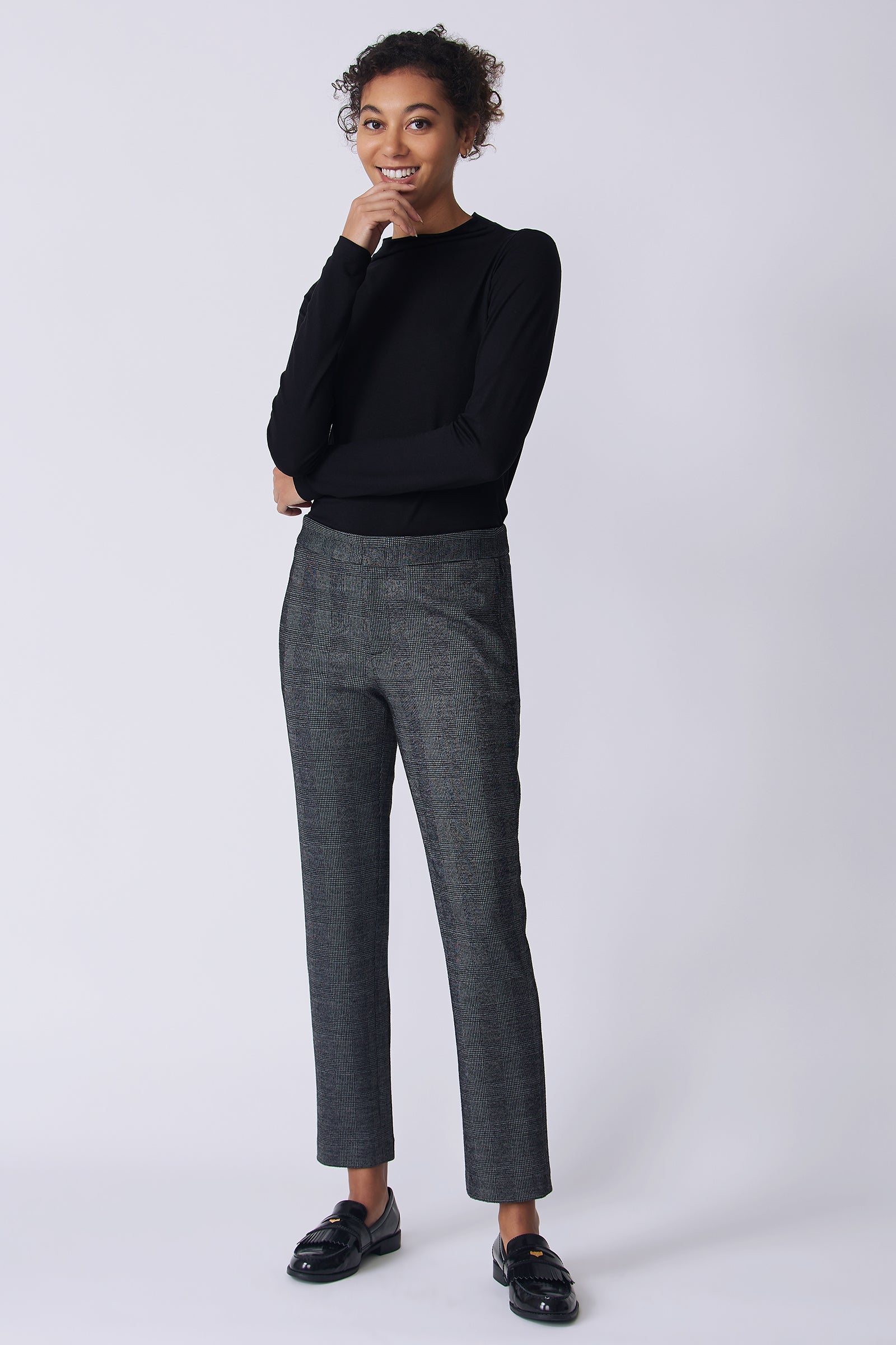 Kal Rieman Madison Pant in black plaid on model front view hands crossed