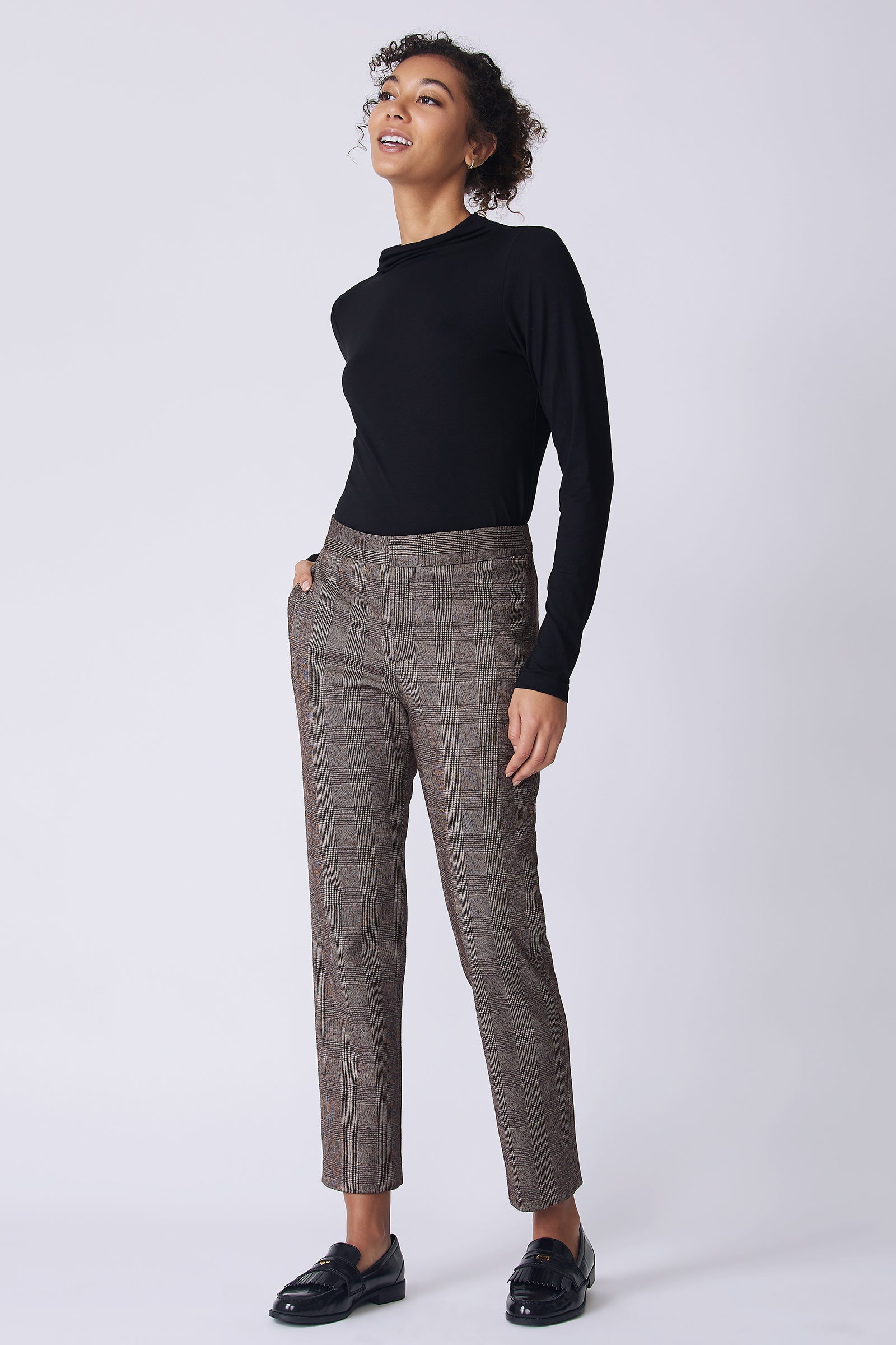 Kal Rieman Madison Pant in brown plaid on model side view looking up