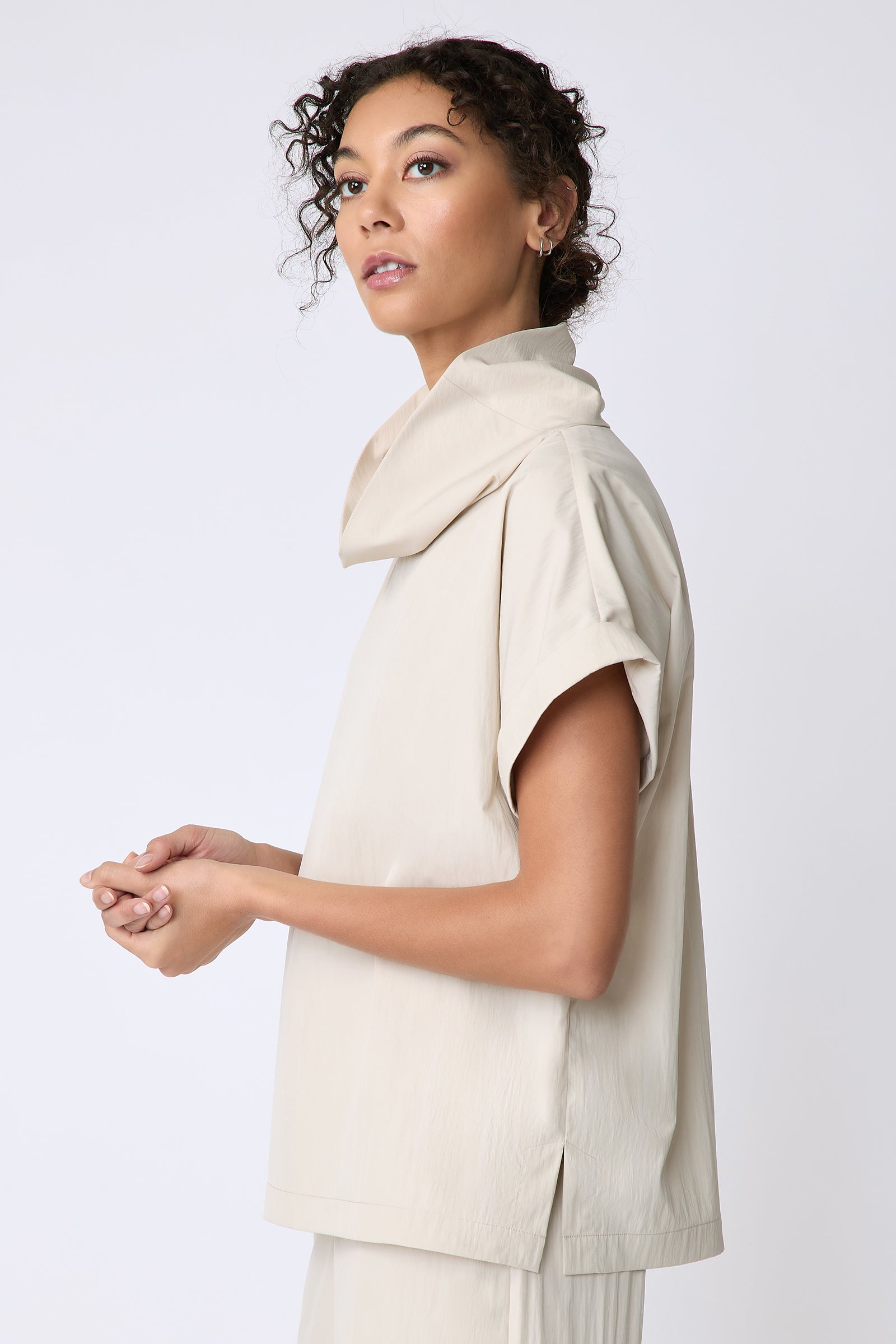 Kal Rieman Maggie Top in Typewriter Cloth khaki on model side view hands in front