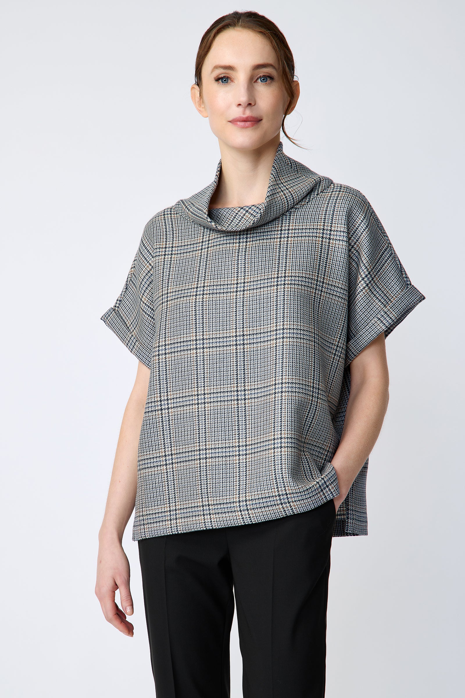 Woman wearing Kal Rieman Marin Top in Glen Plaid and black pants on a white background, hand in pant pocket close view