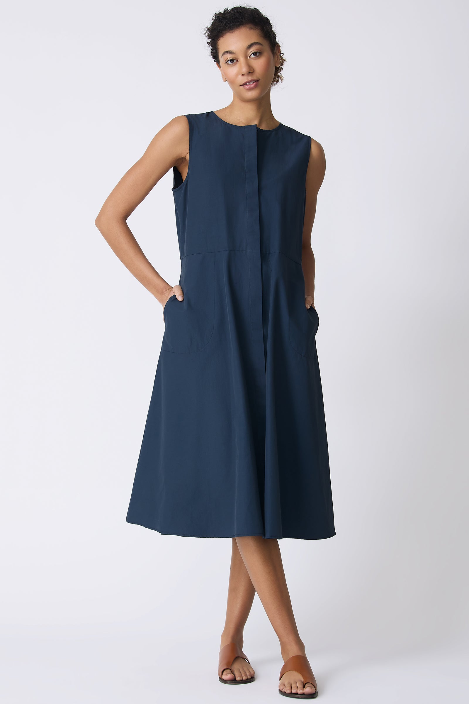 Kal Rieman Marina Dress in Summer Navy on model with hands in pockets full front view