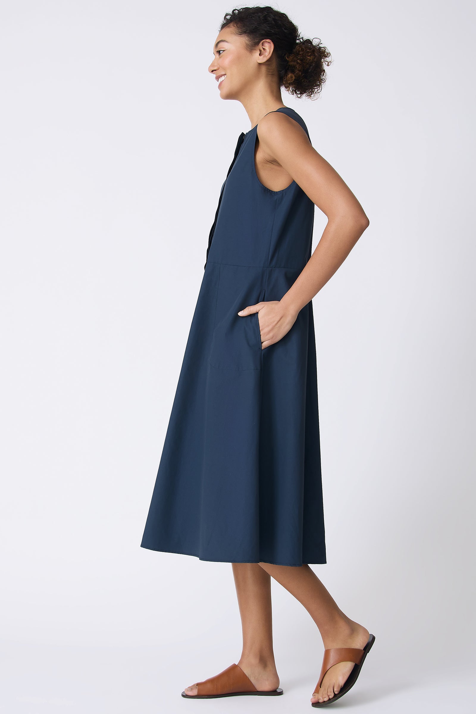 Kal Rieman Marina Dress in Summer Navy on model with hands in pockets full side view
