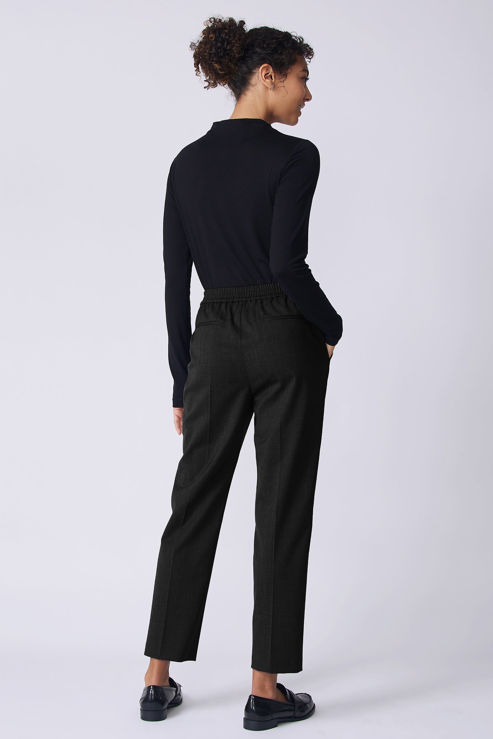 Kal Rieman Martine Trouser in Black wool suiting on model back view