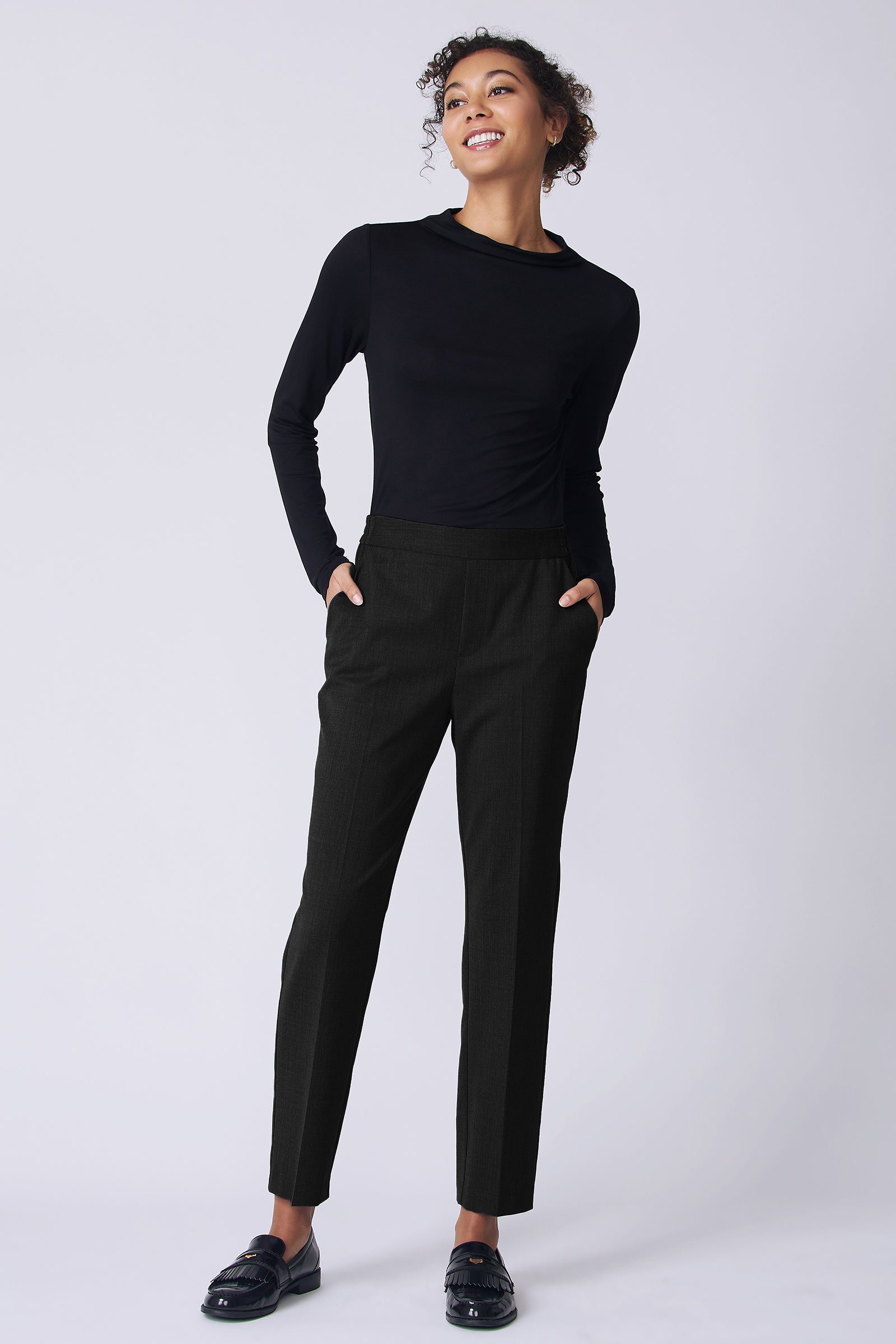 Kal Rieman Martine Trouser in Black wool suiting on model front view hands in pockets