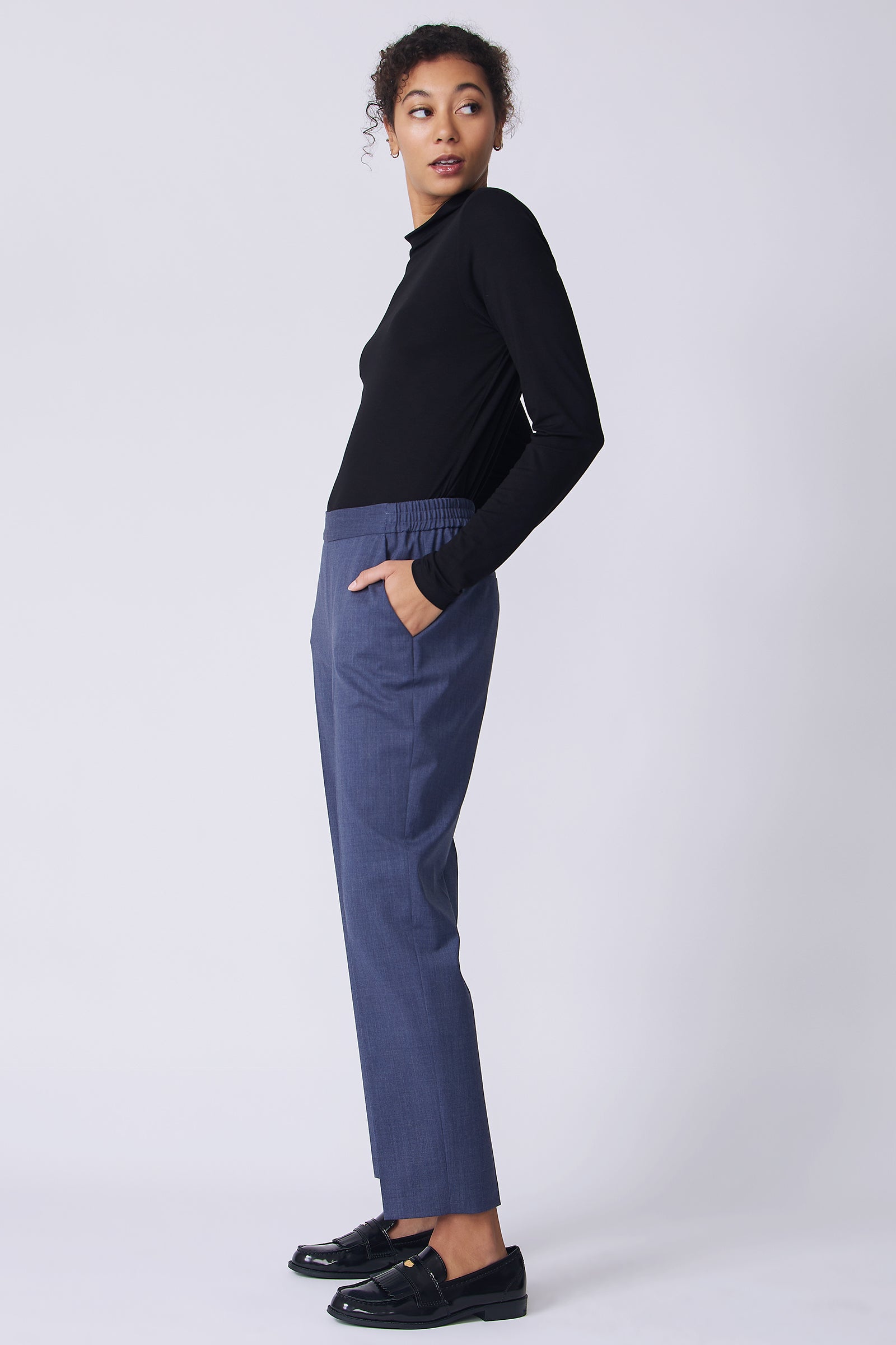 Kal Rieman Martin Trouser in Italian denim suiting on model side view hands in pockets
