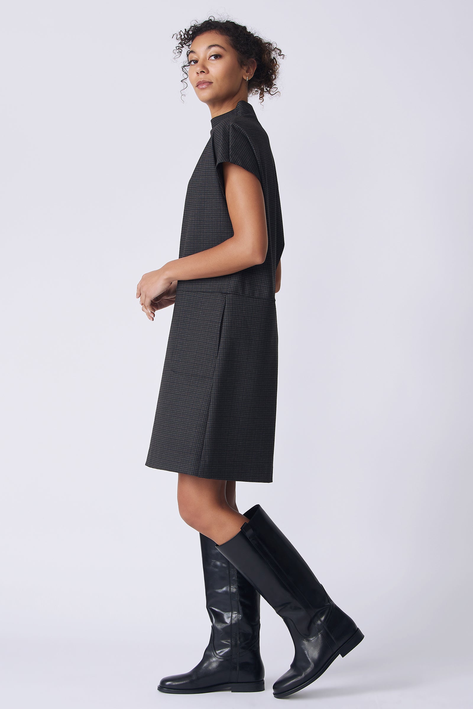 Kal Rieman Maya Funnelneck Dress in mini check ponte on model side view hand in pocket