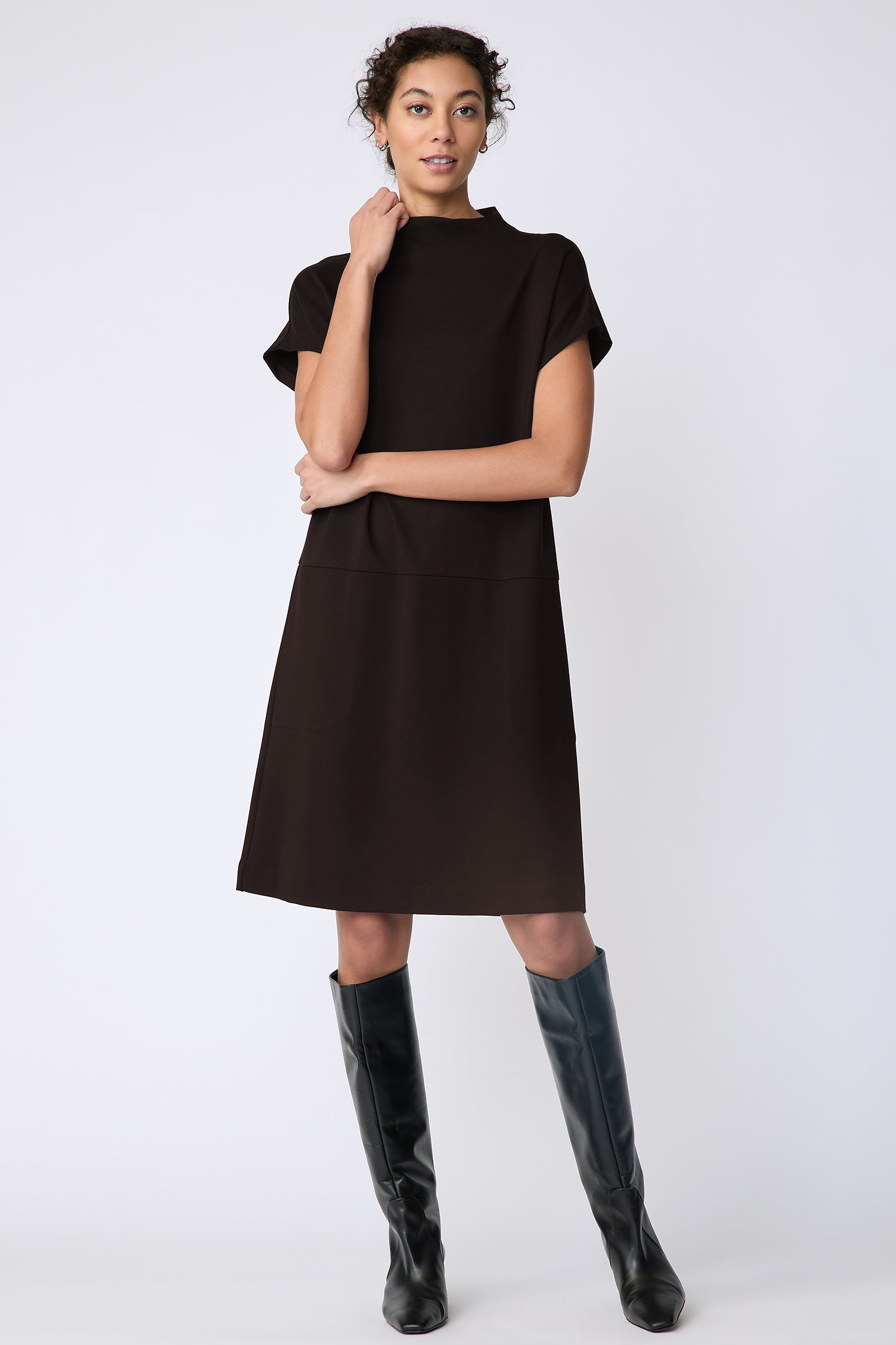 Kal Rieman Maya Funnelneck dress in espresso ponte on model front view holding collar