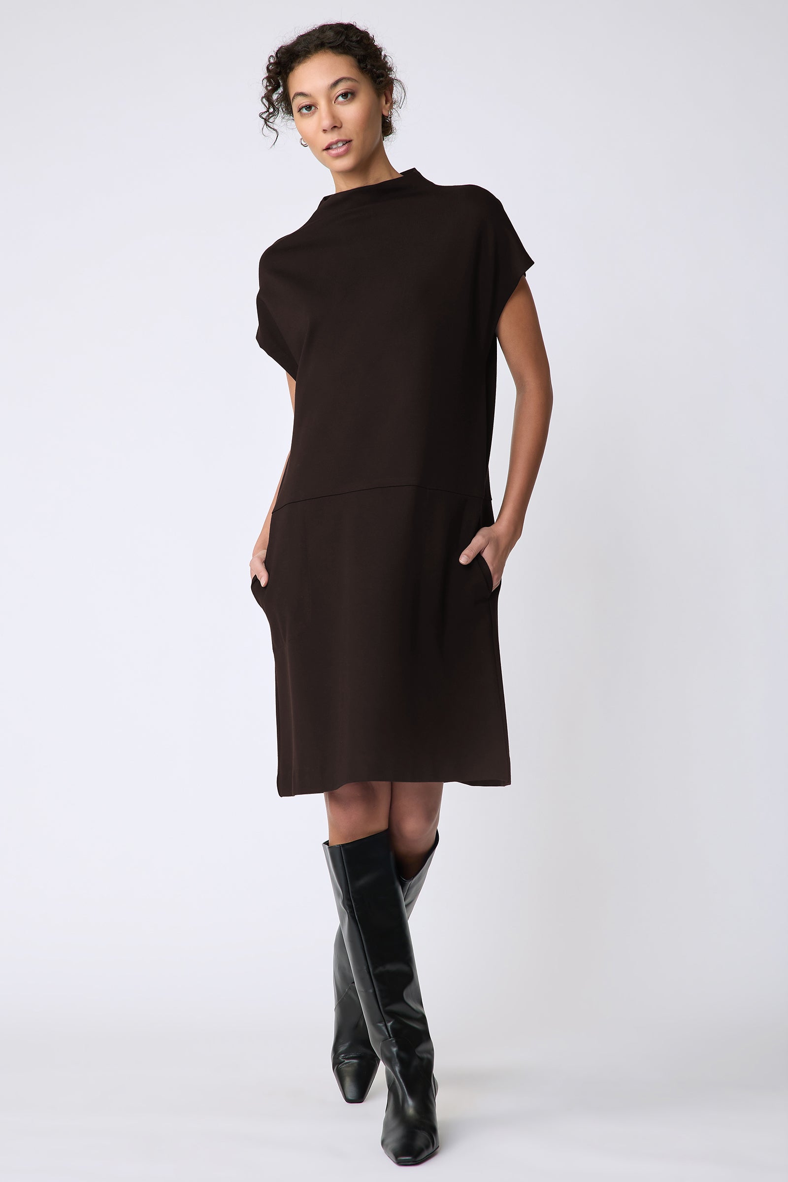 Kal Rieman Maya Funnelneck dress in espresso ponte on model front view walking hands in pocket