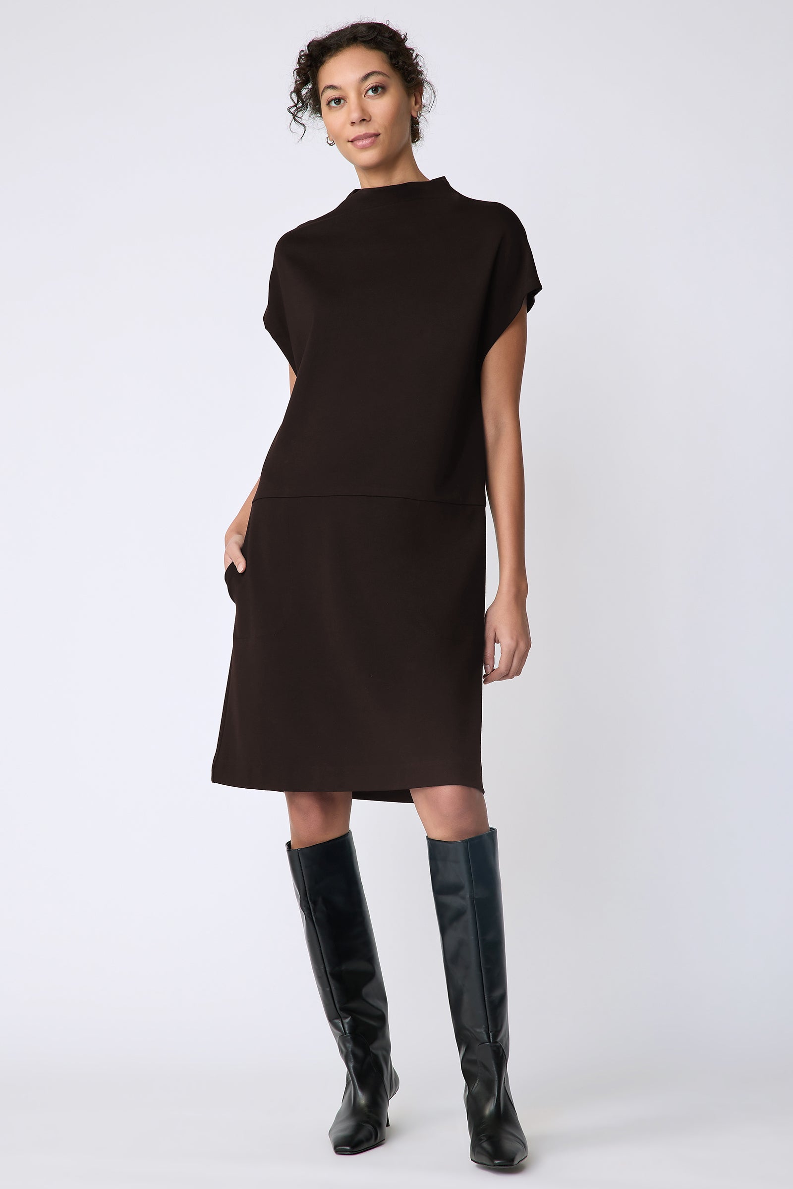 Kal Rieman Maya Funnelneck dress in espresso ponte on model front view walking hands in pocket