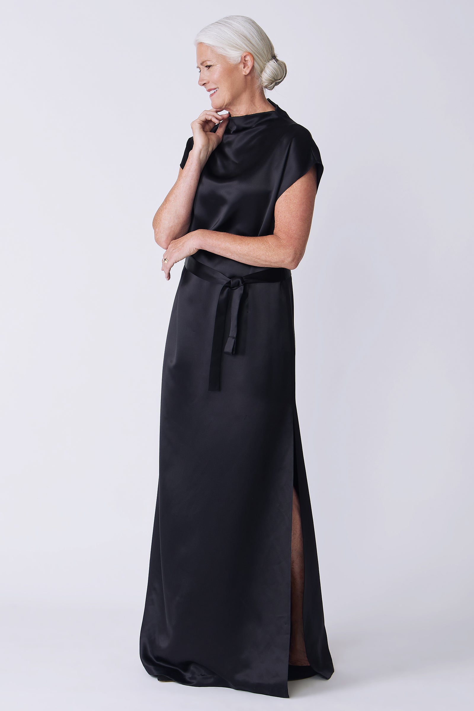 Kal Rieman Maya Gown in black on model side view hand on collar