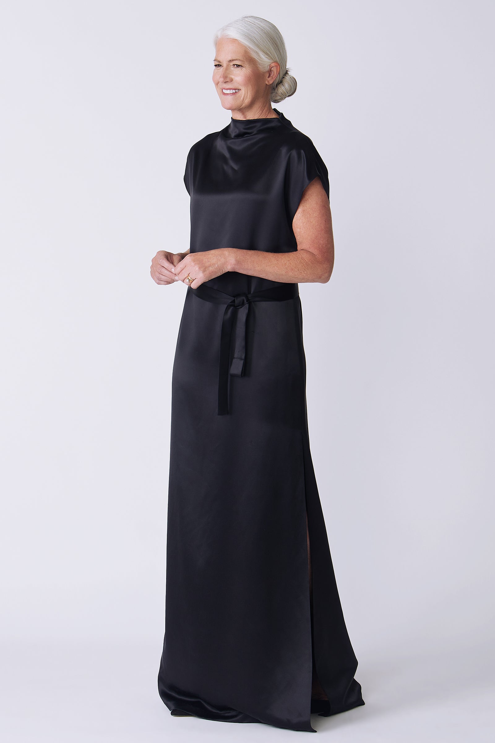 Kal Rieman Maya Gown in black on model side view hands in front