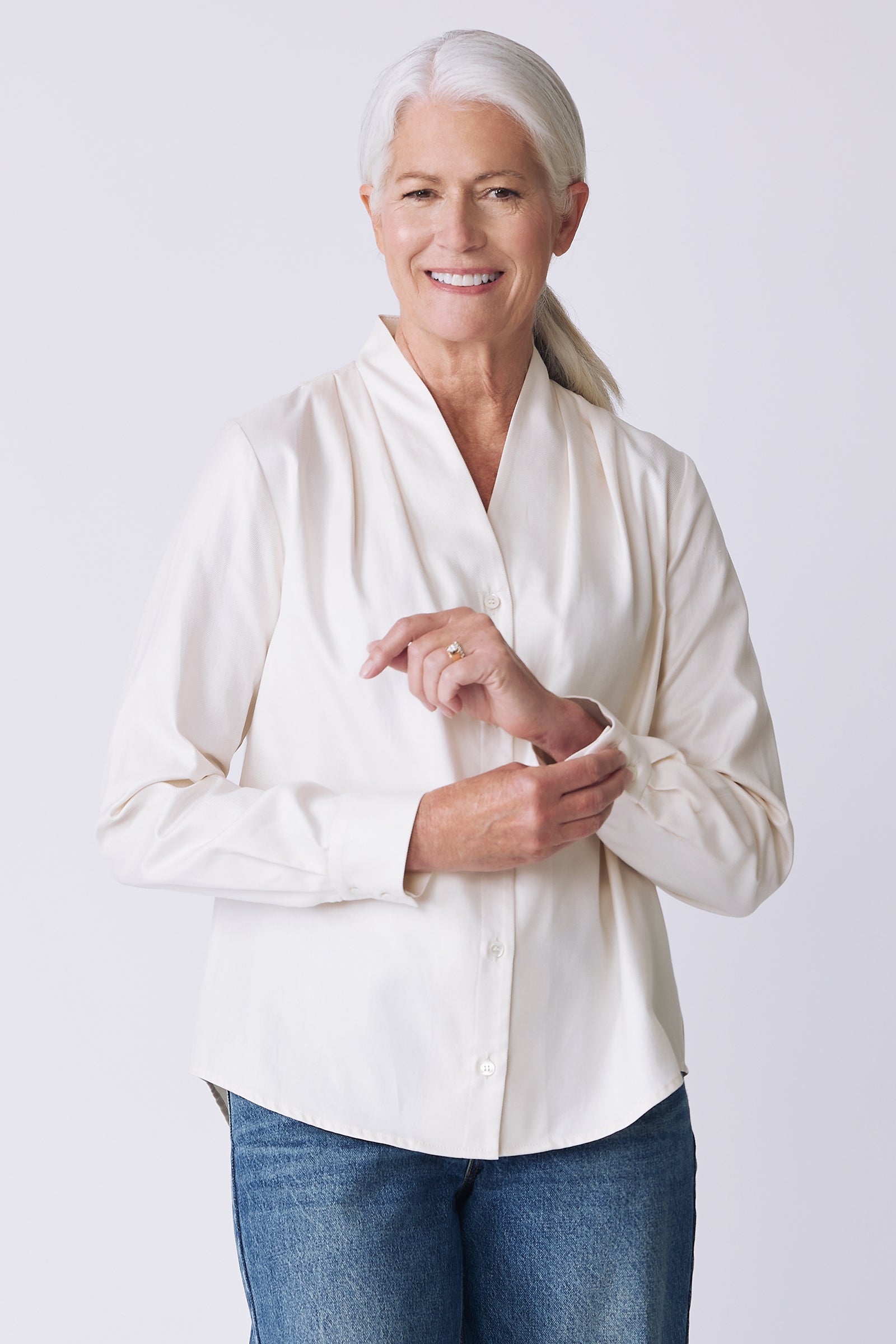 Kal Rieman Nadia Blouse in soft twill ivory on model front view holding cuff