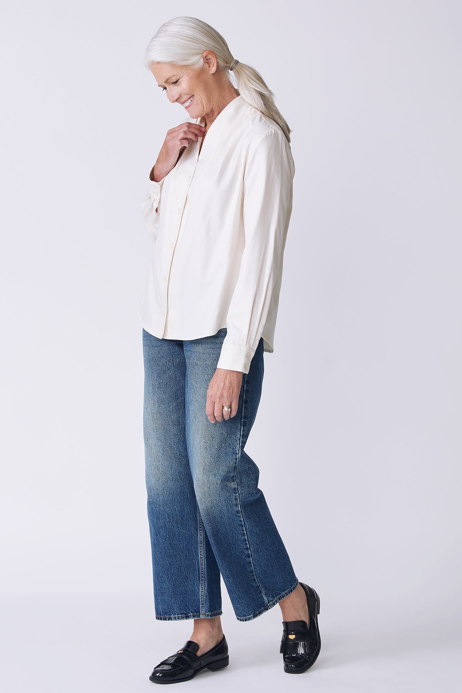 Kal Rieman Nadia Blouse in soft twill ivory on  model side view walking