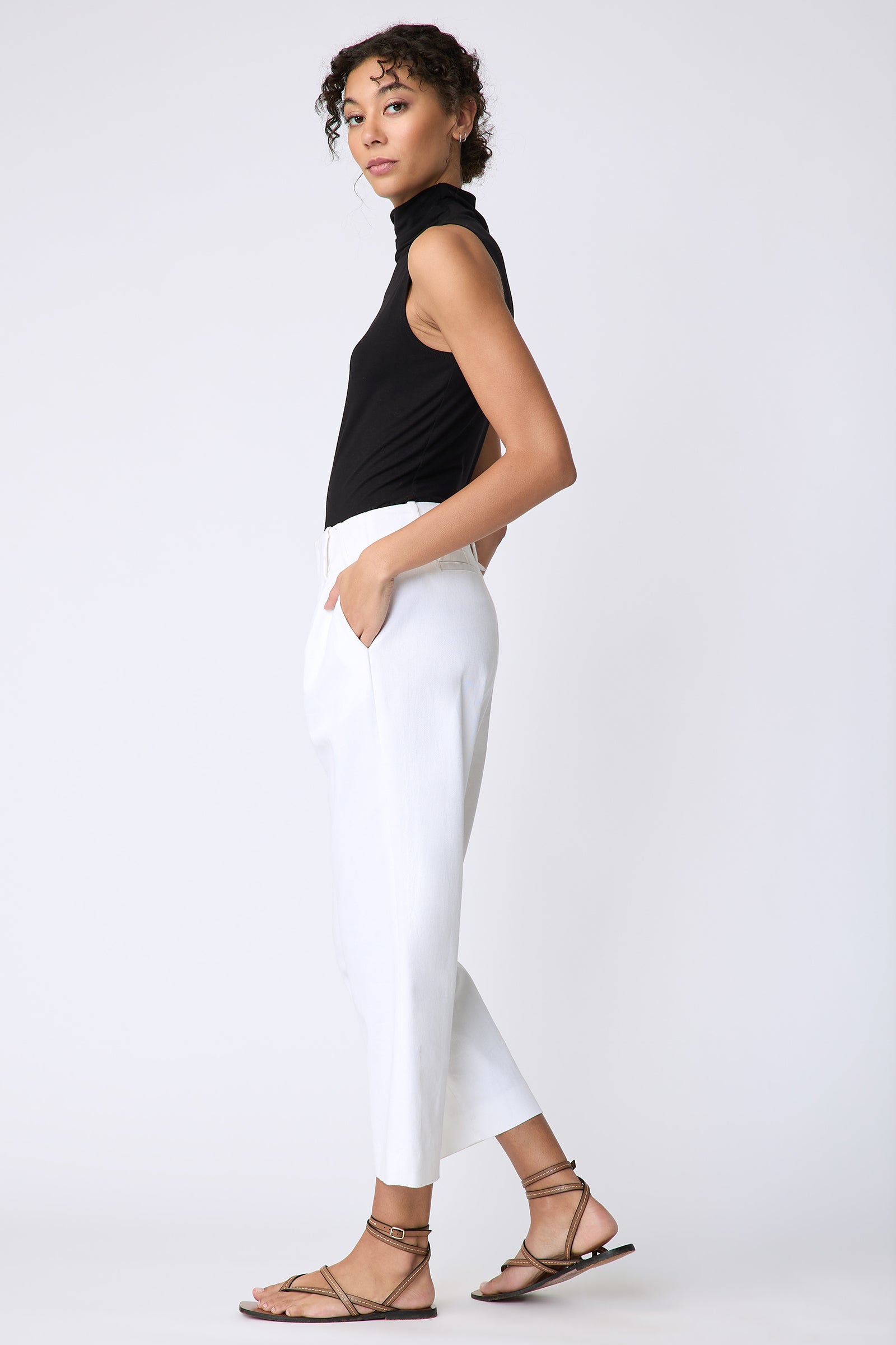 Kal Rieman Nolan Pant in Italian stretch twill on model side view hands in pockets