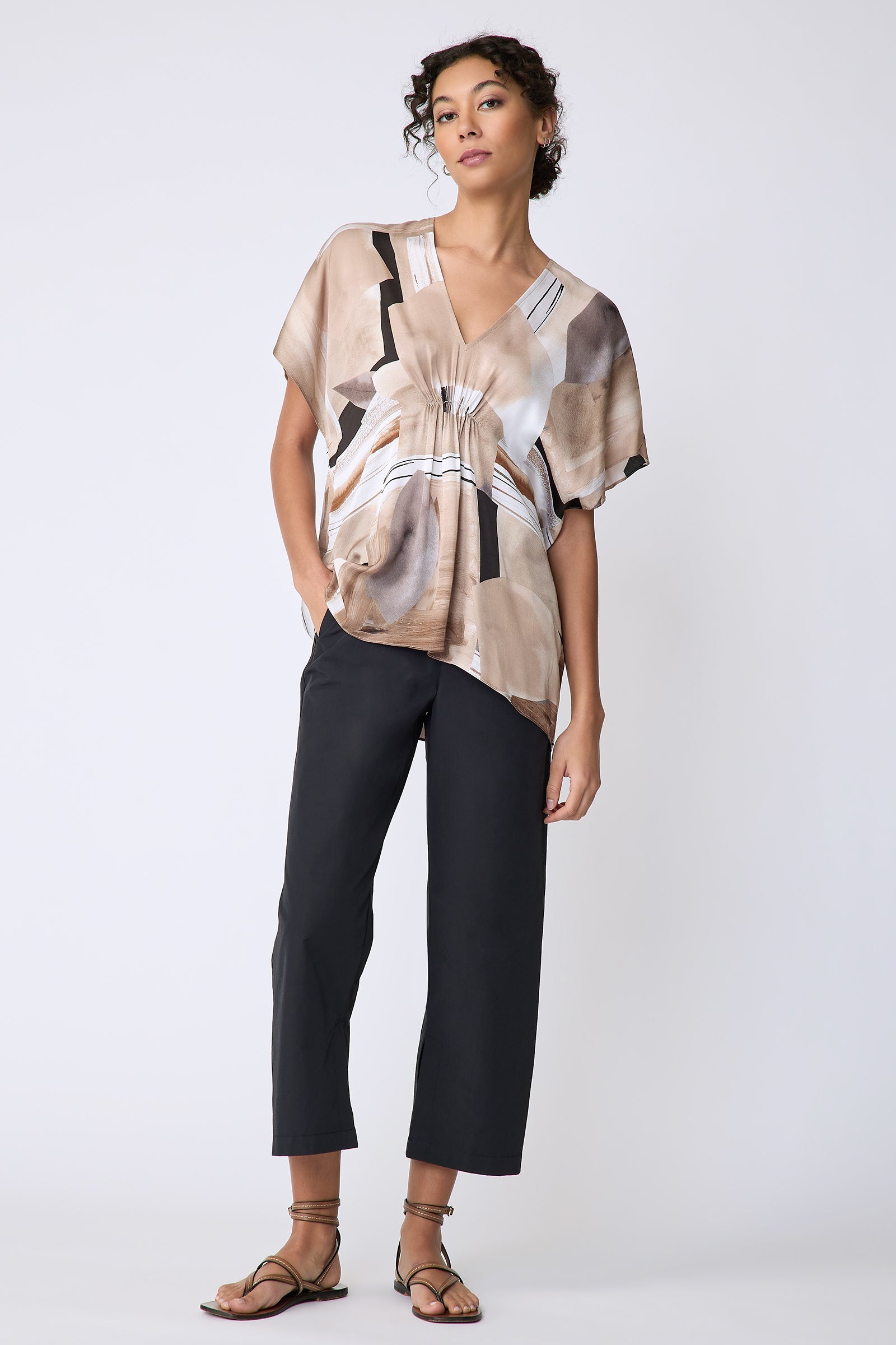 Kal Rieman Paloma Top in Sante Fe print Sand on model front view full hand in pocket