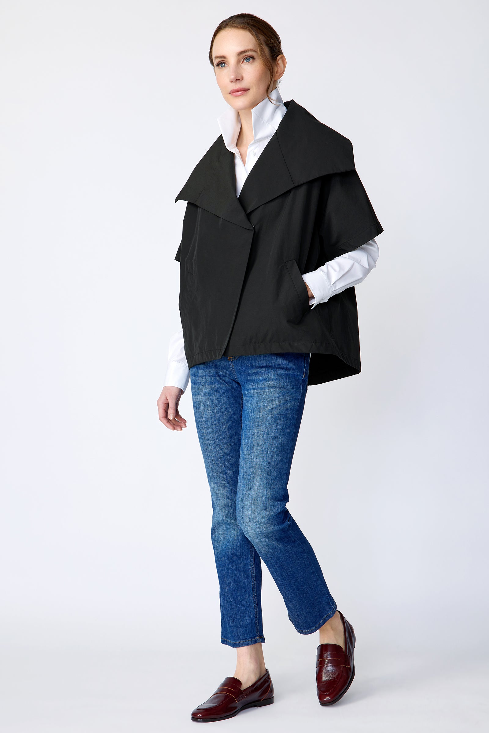 Kal Rieman Paris Jacket in Black Italian broadcloth on model side view full hand in pocket walking