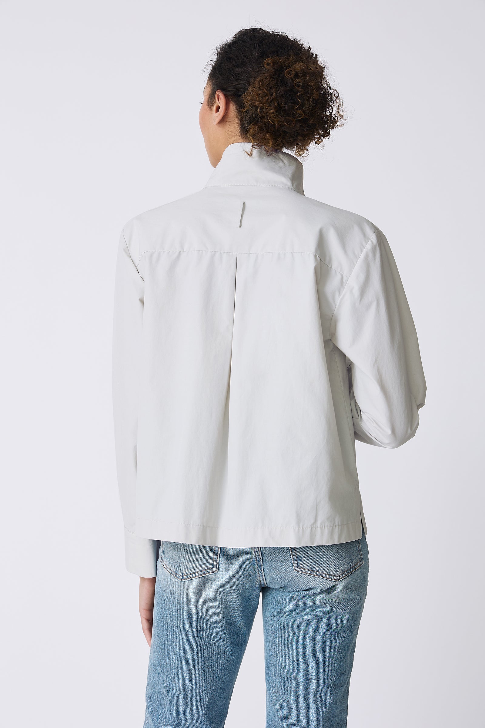 Kal Rieman Peggy Collared Shirt in Stone on model touching shirt full front view