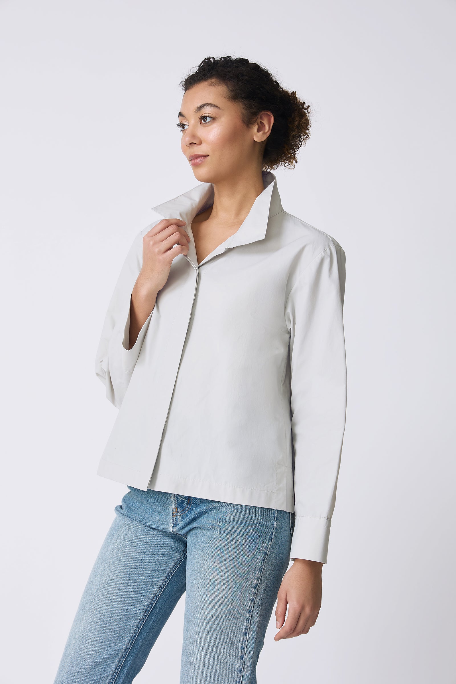 Kal Rieman Peggy Collared Shirt in Stone on model touching collar side view