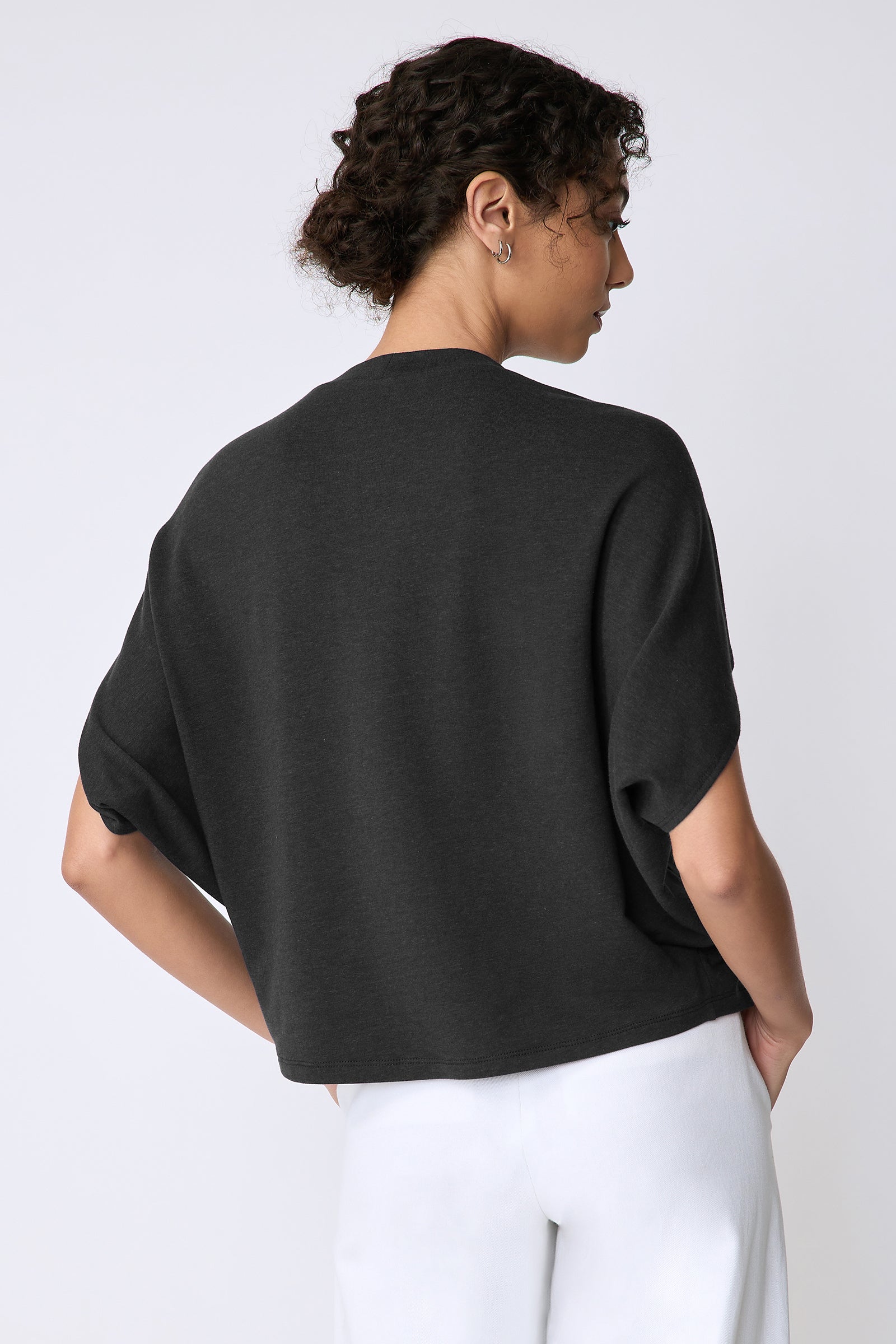 Kal Rieman Phoenix Cape Top in black on model front view full look holding arm