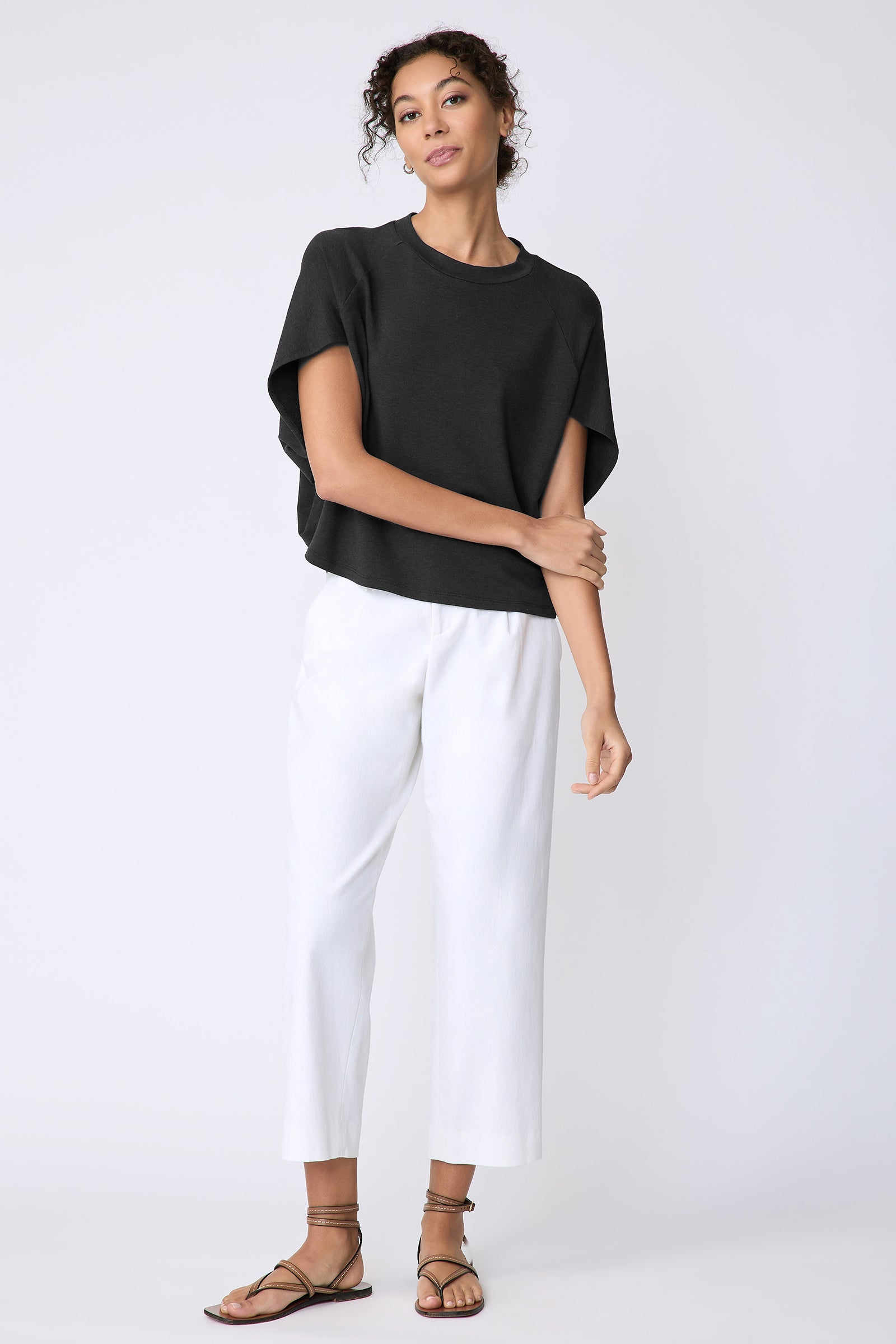 Kal Rieman Phoenix Cape Top in black on model front view full look holding arm