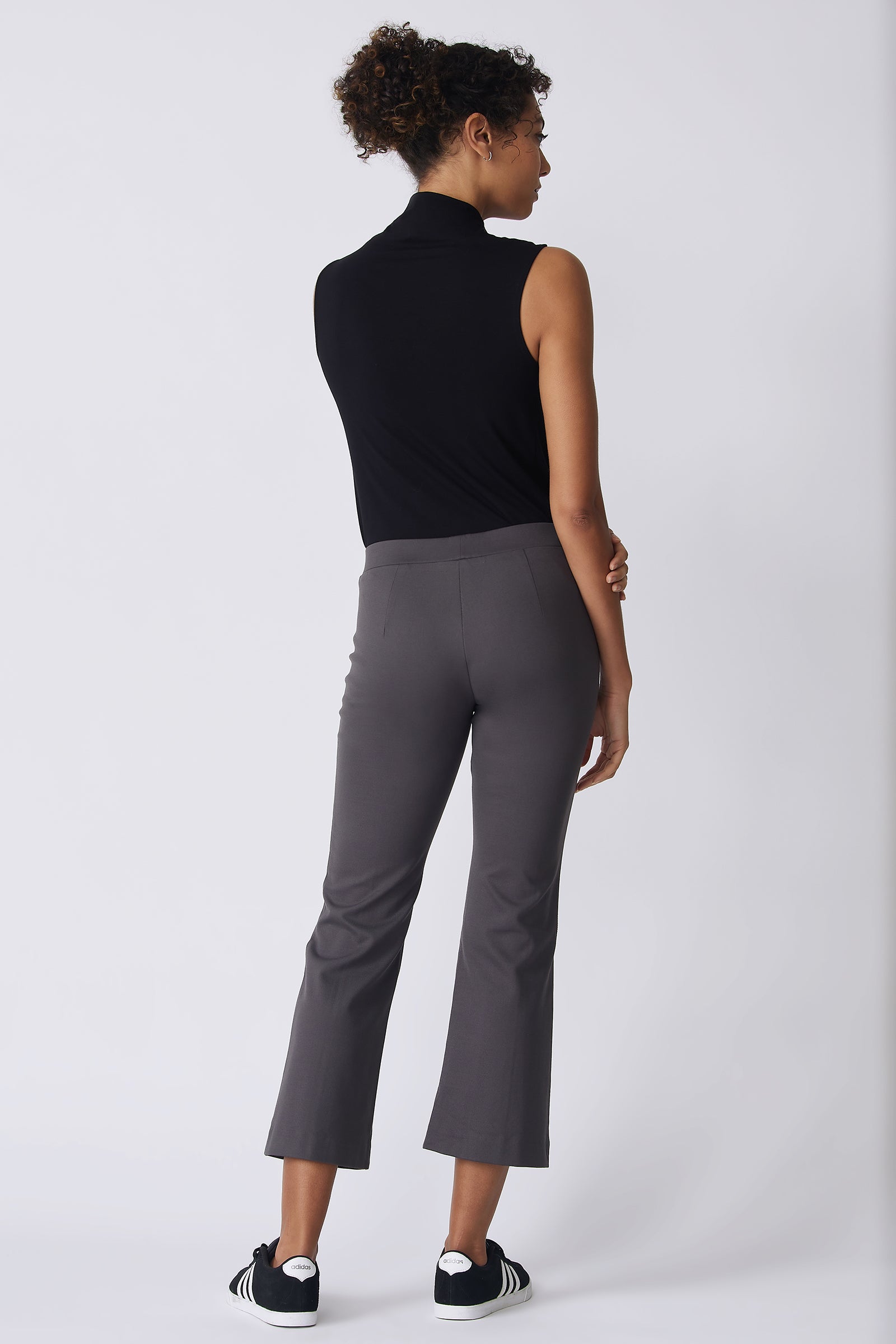 Kal Rieman Pintuck Crop Flare in charcoal ponte on model back view holding arm
