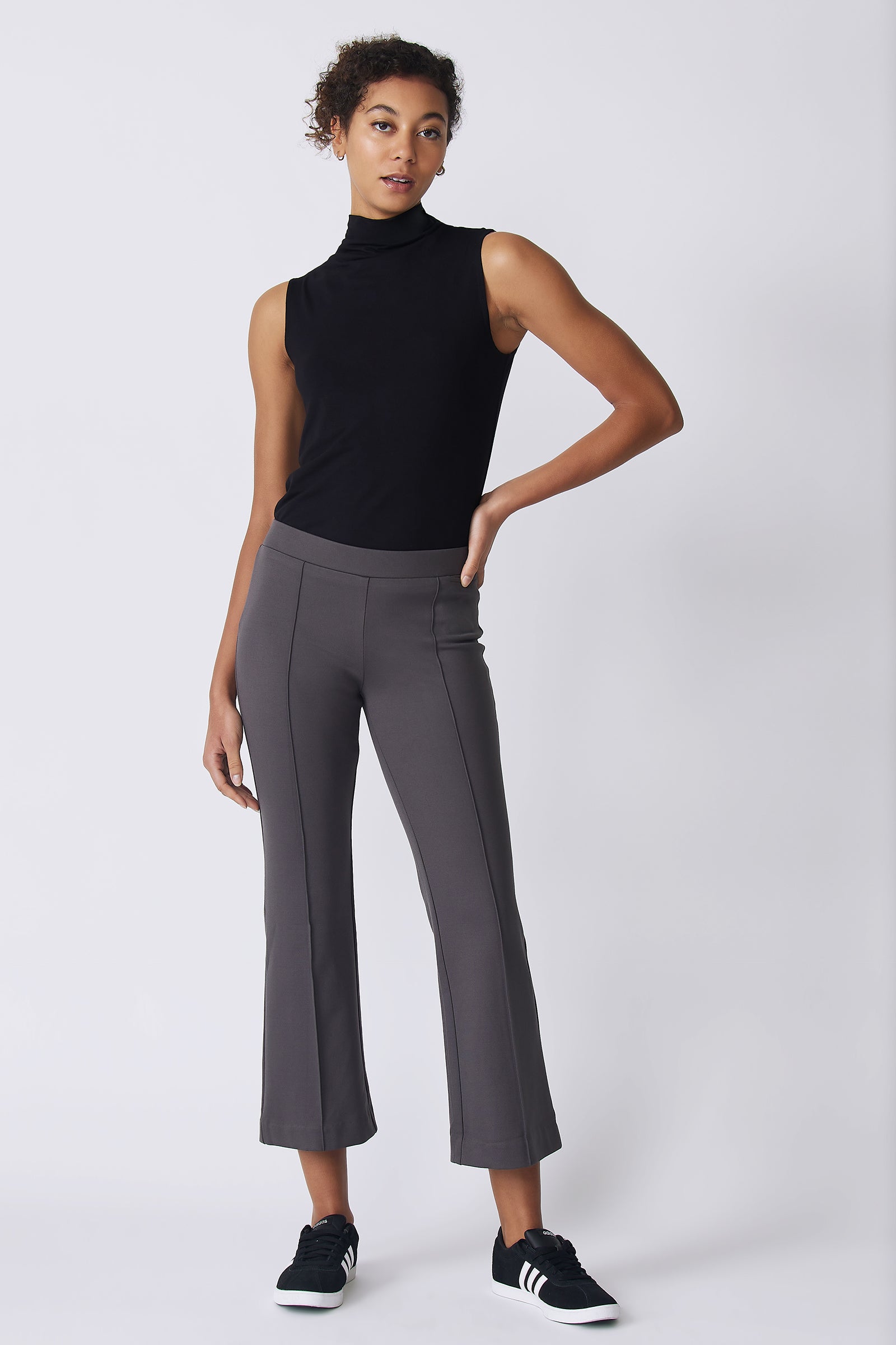 Kal Rieman Pintuck Crop Flare in charcoal ponte on model front view with hand on hip