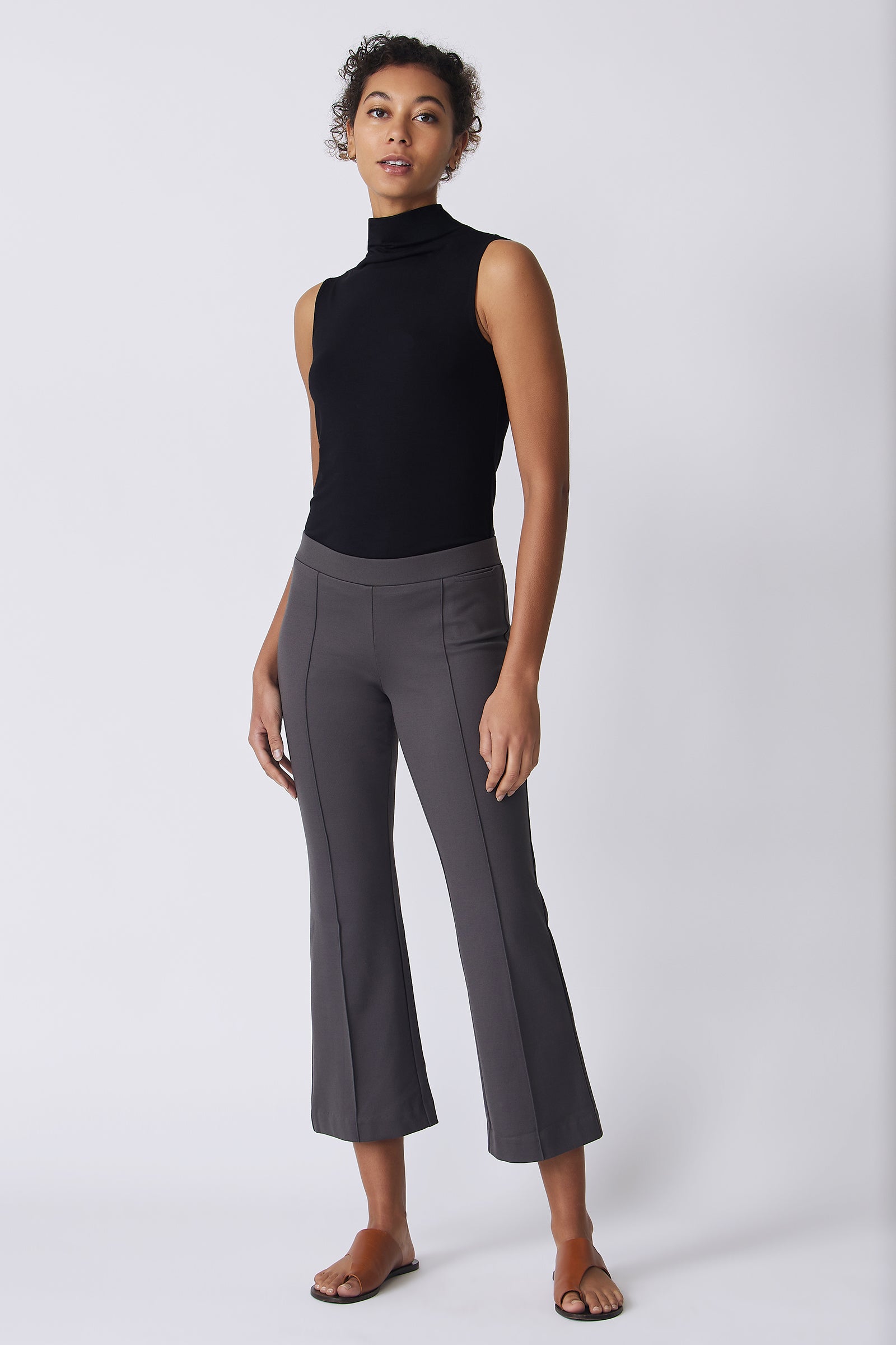Kal Rieman Pintuck Crop Flare in charcoal ponte on model front view with hands at side