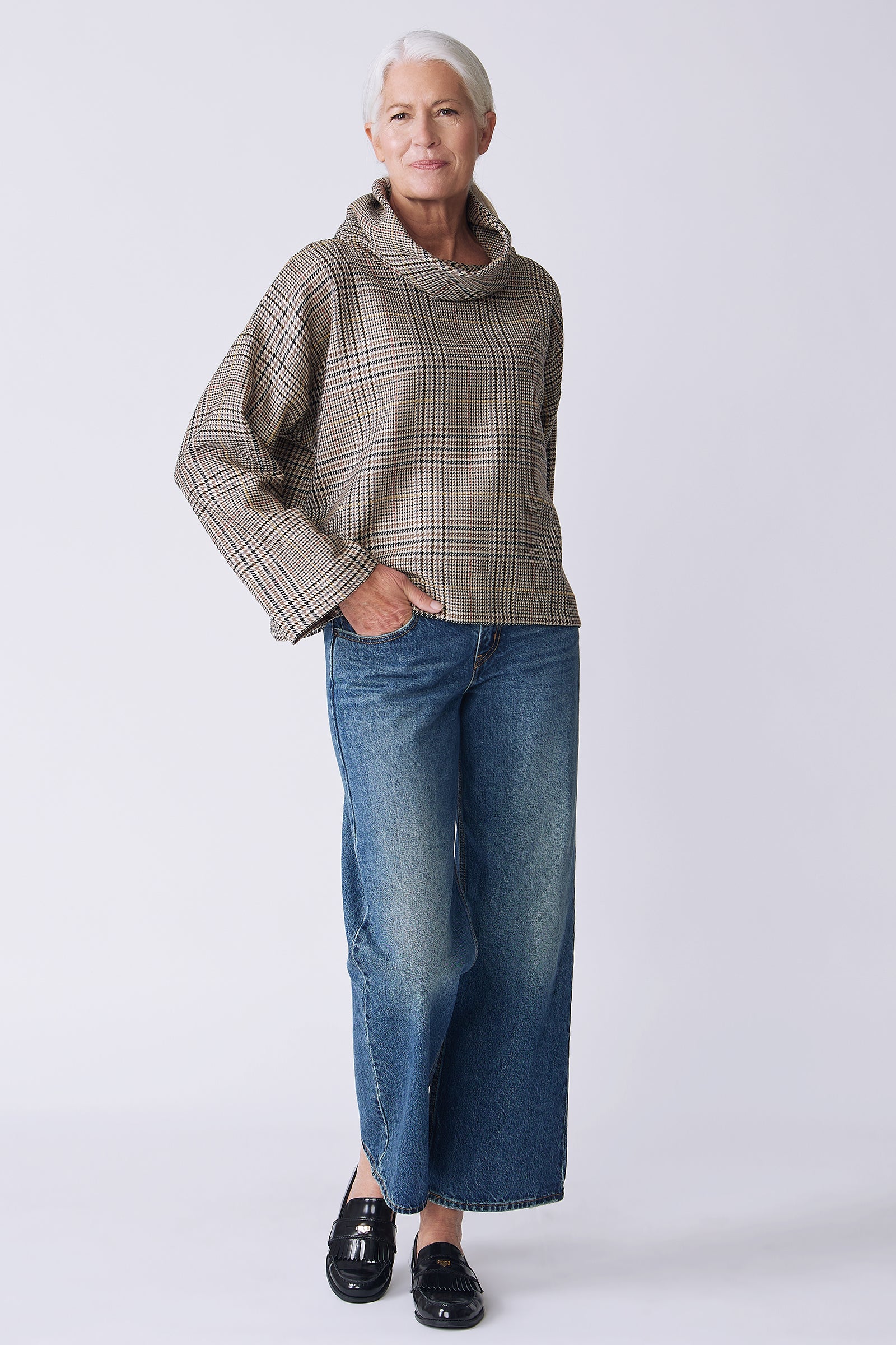 Kal Rieman Polina Bias Tneck Pullover in italian plaid on model front view hand in pocket