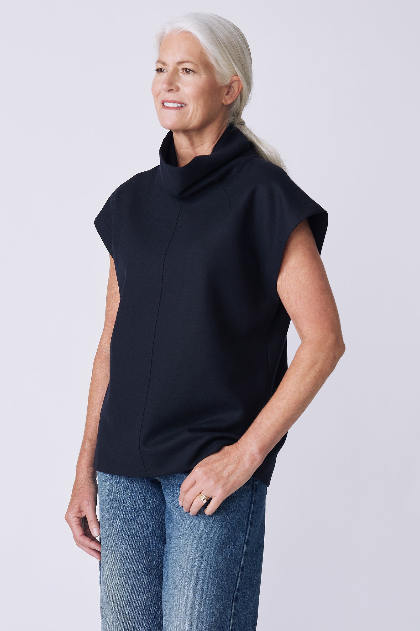 Kal Rieman Raw Edge Seam Tneck in Midnight Felted Jersey on model side view hand in pocket