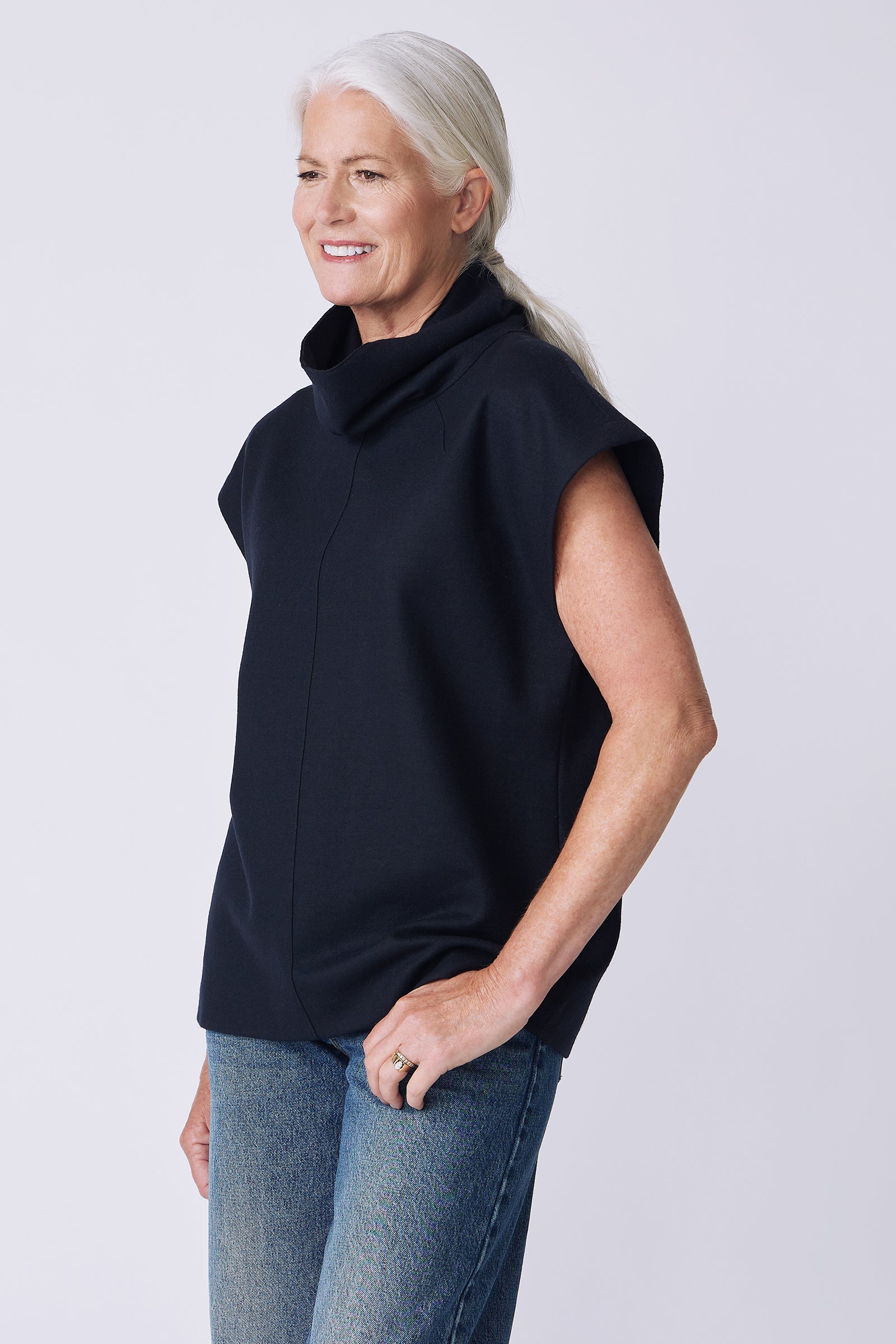 Kal Rieman Raw Edge Seam Tneck in Midnight Felted Jersey on model side view hand in pocket