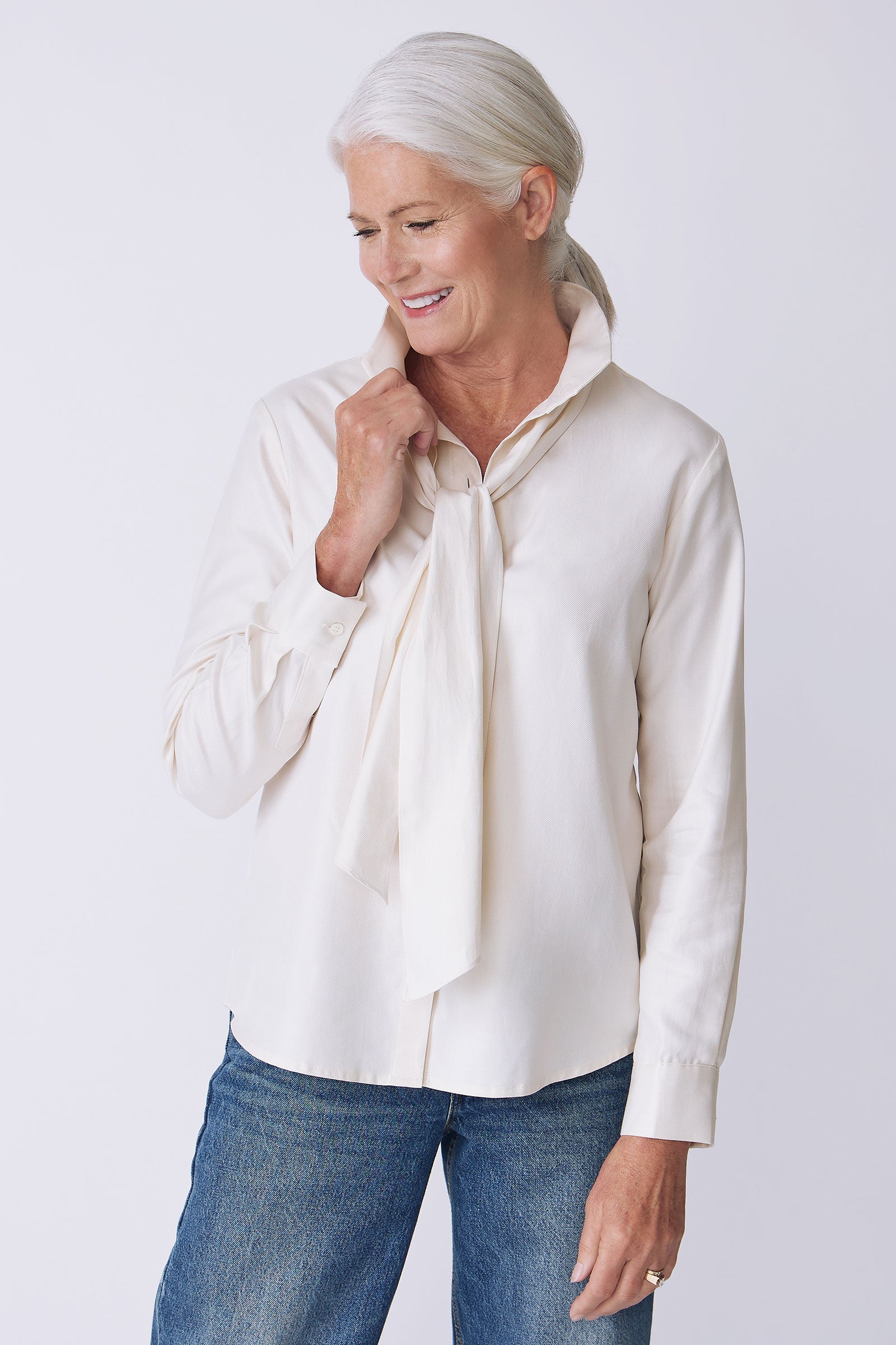 Kal Rieman Regency Blouse in ivory soft twill on model side view detail holding scarf