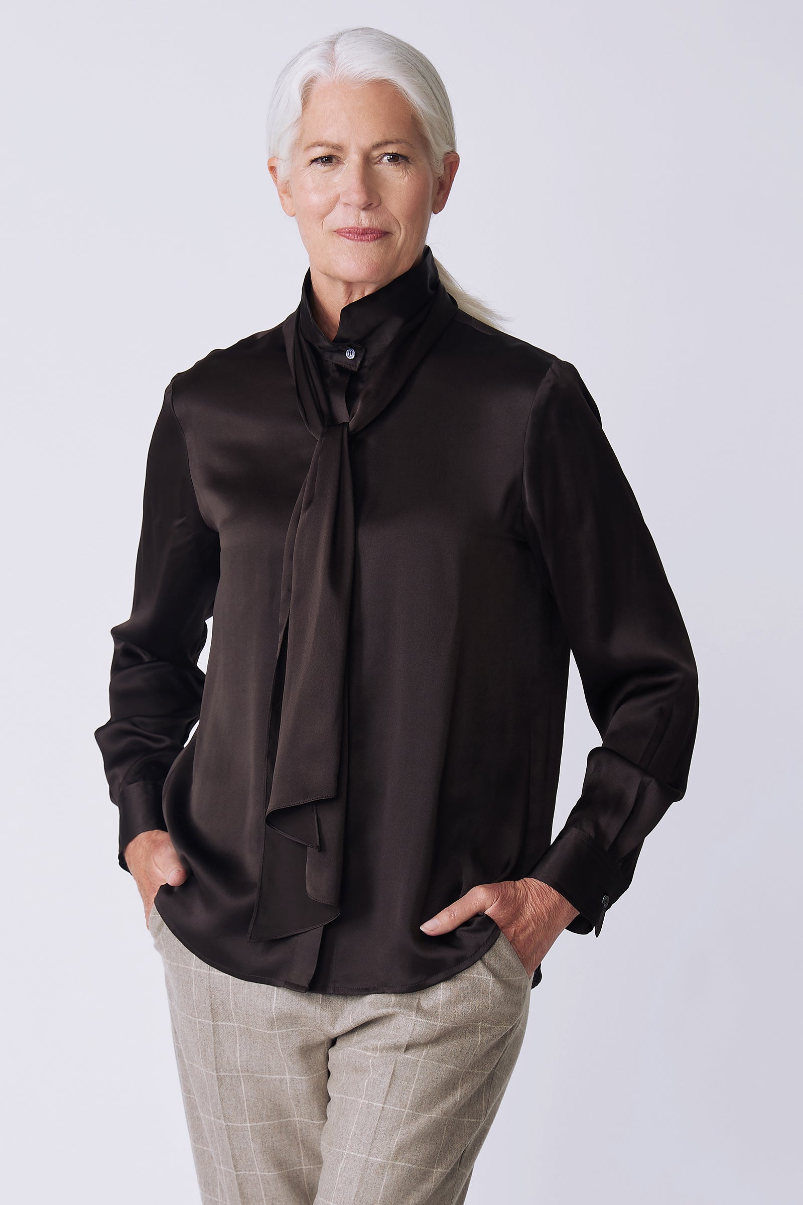 Kal Rieman Regency Silk Blouse in espresso color charmeuse on model side view hands in pockets