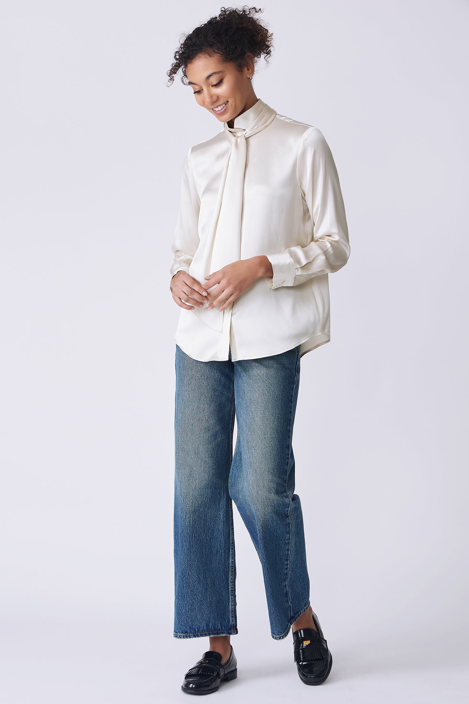 Kal Rieman Regency Silk Blouse in oyster color charmeuse on model side view walking holding scarf