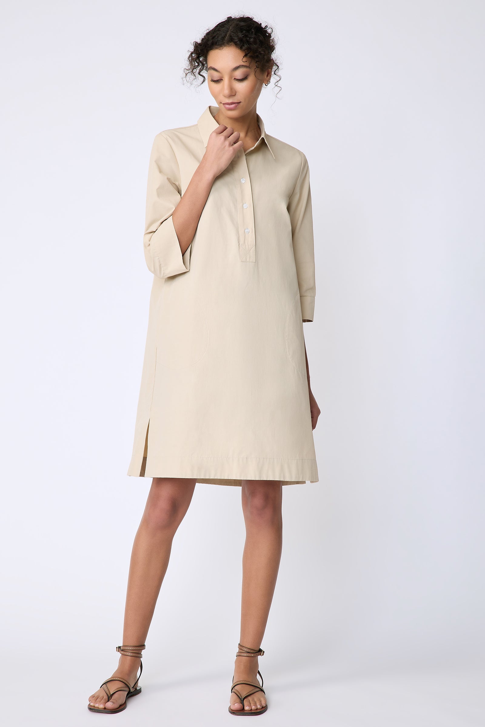 Kal Rieman Rene Placket Dress in Italian Broadcloth color sand on model front view holding collar
