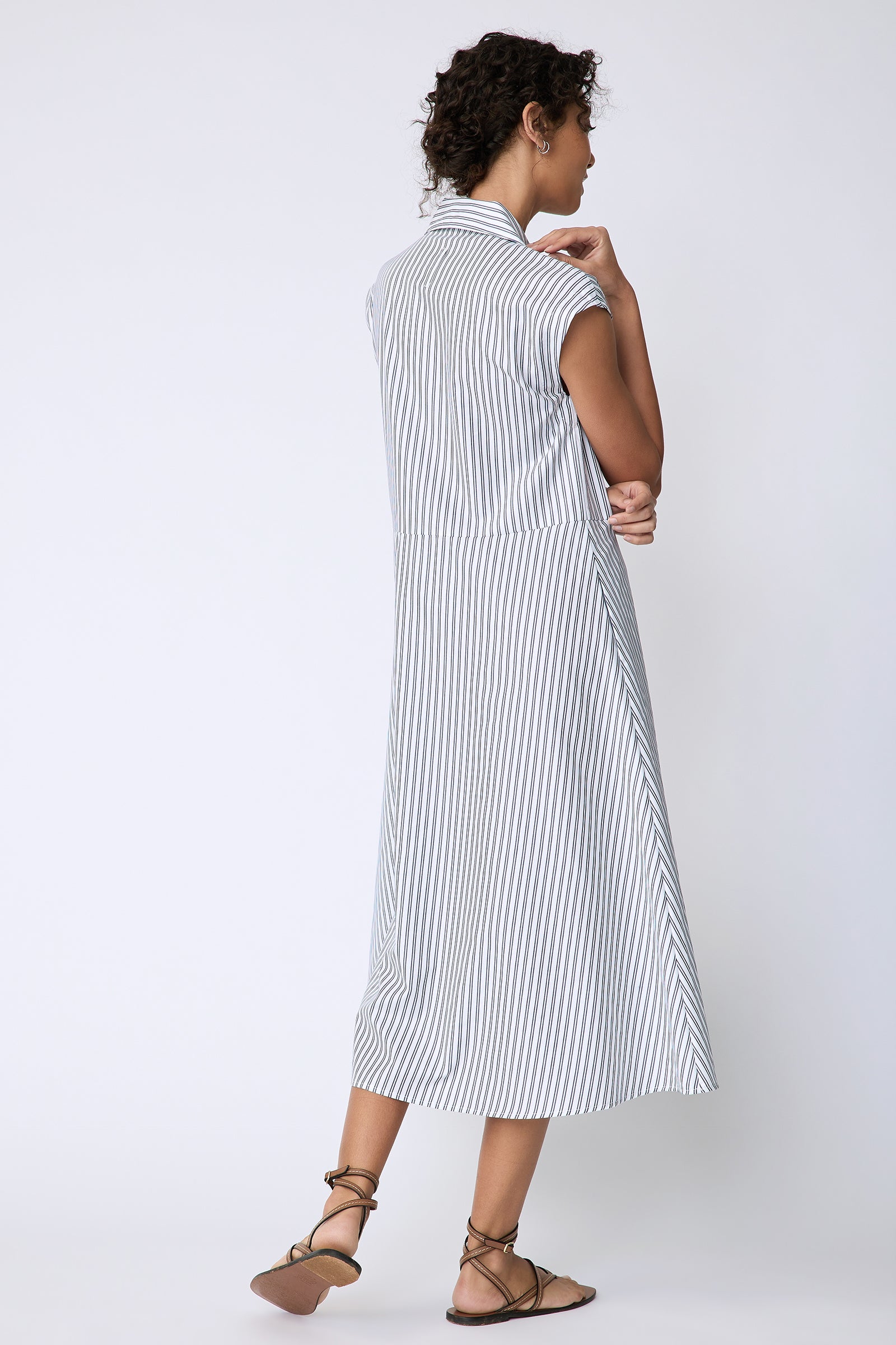 Kal Rieman Savannah Dress in European Cotton white with navy stripe on model back view walking