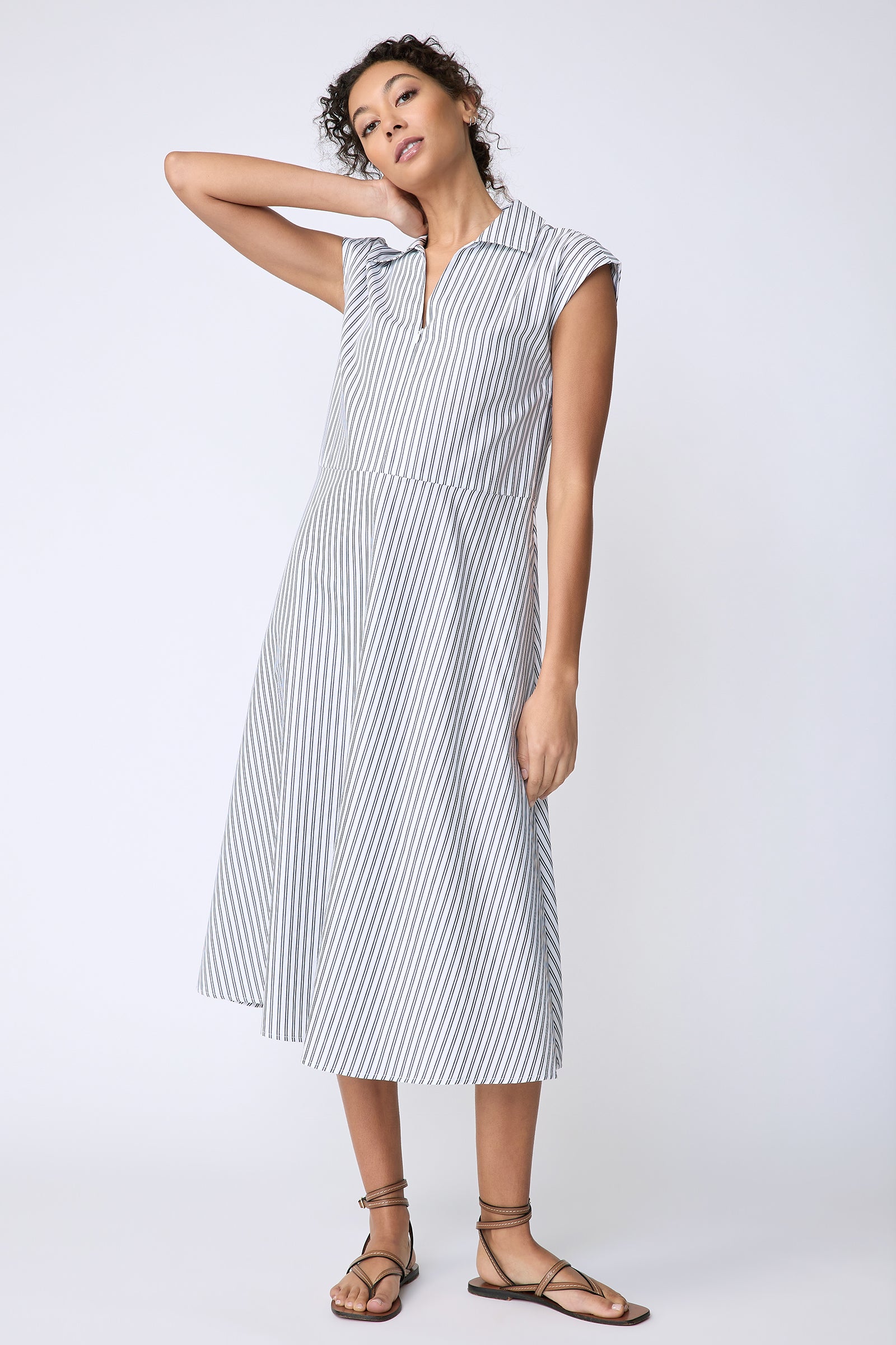 Kal Rieman Savannah Dress in European Cotton white with navy stripe on model front view hand on neck