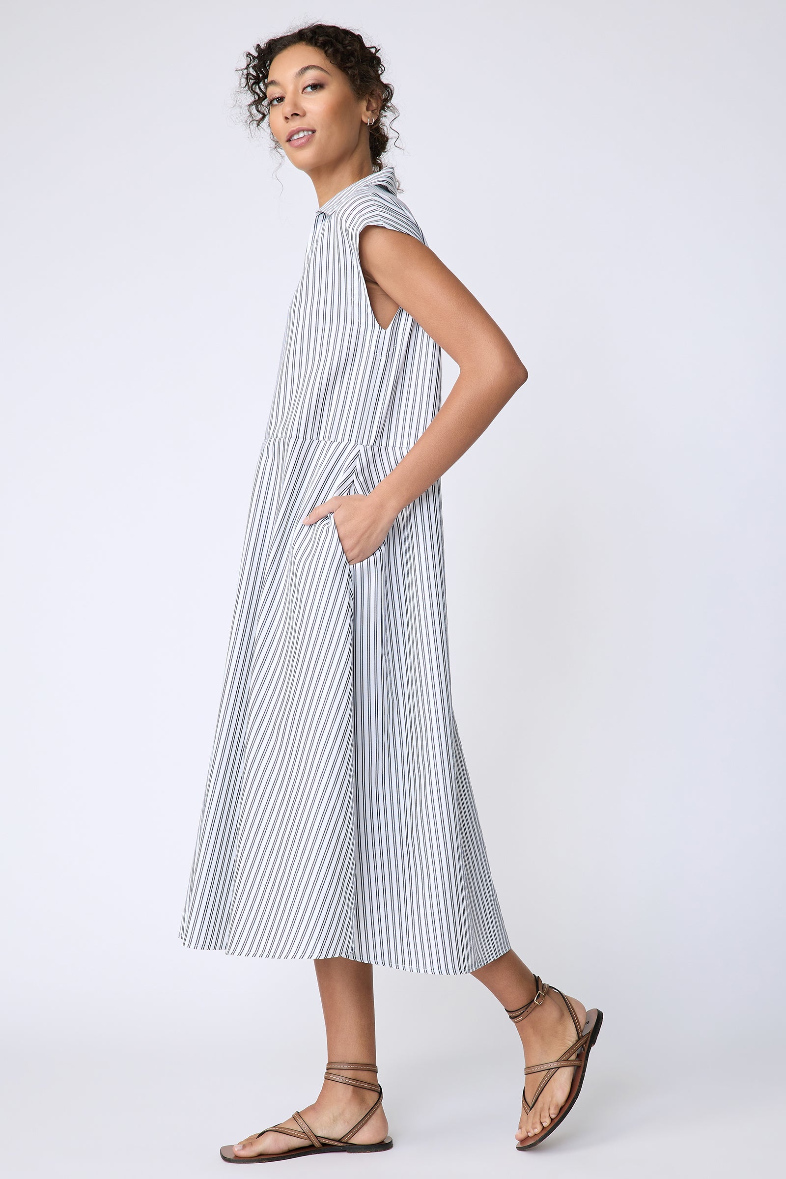 Kal Rieman Savannah Dress in European Cotton white with navy stripe on model side view walking