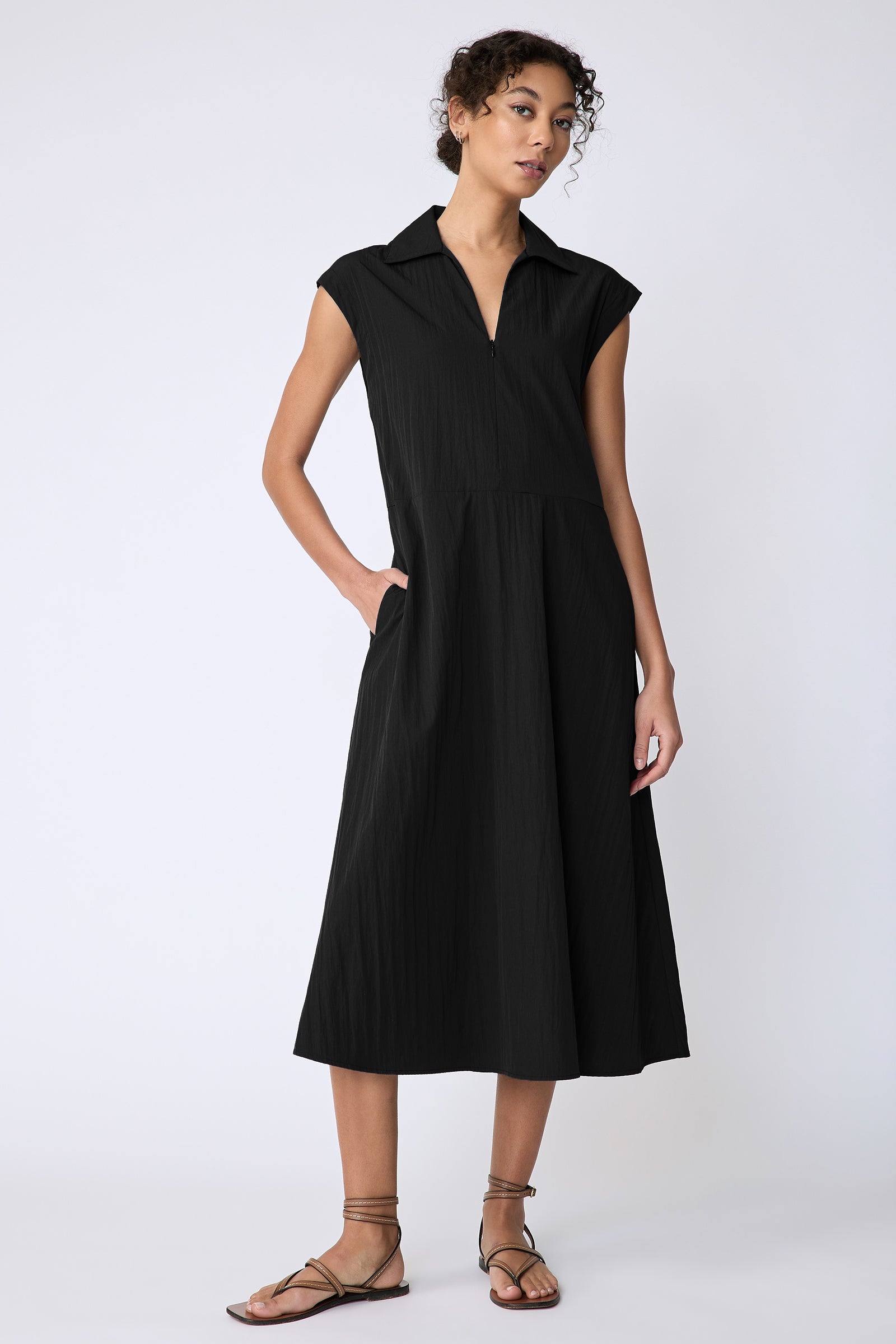 Kal Rieman Savannah Dress in black typewriter cloth on model hand in pocket