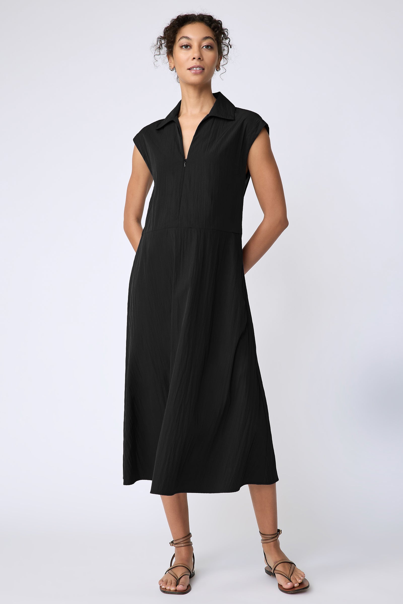 Kal Rieman Savannah Dress in black typewriter cloth on model hands behind back