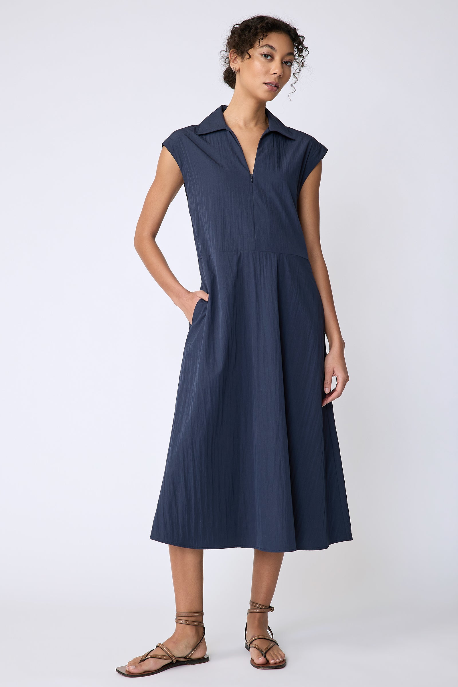 Kal Rieman Savannah Dress in navy typewriter cloth on model front view hand in pocket