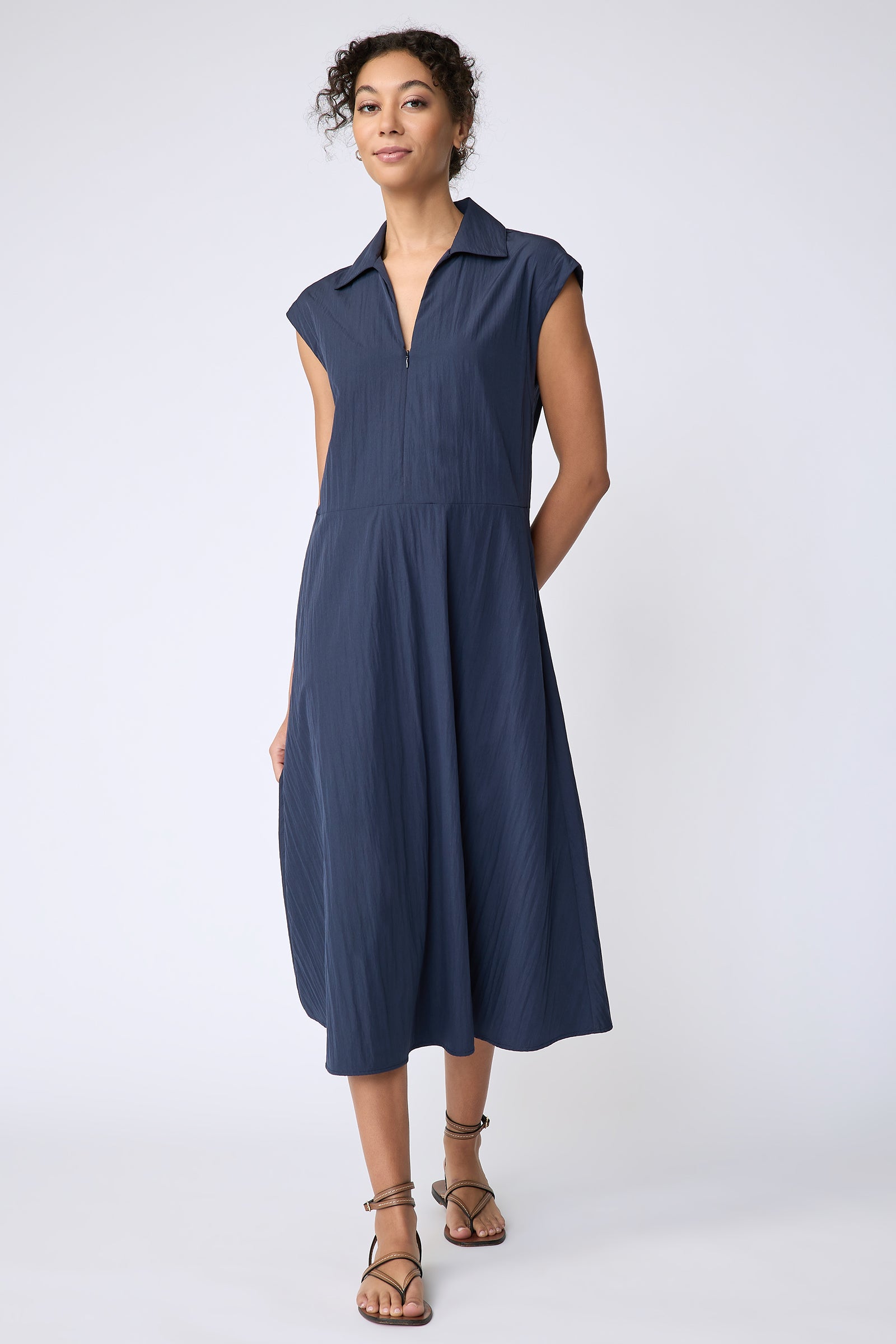 Kal Rieman Savannah Dress in navy typewriter cloth on model front view walking