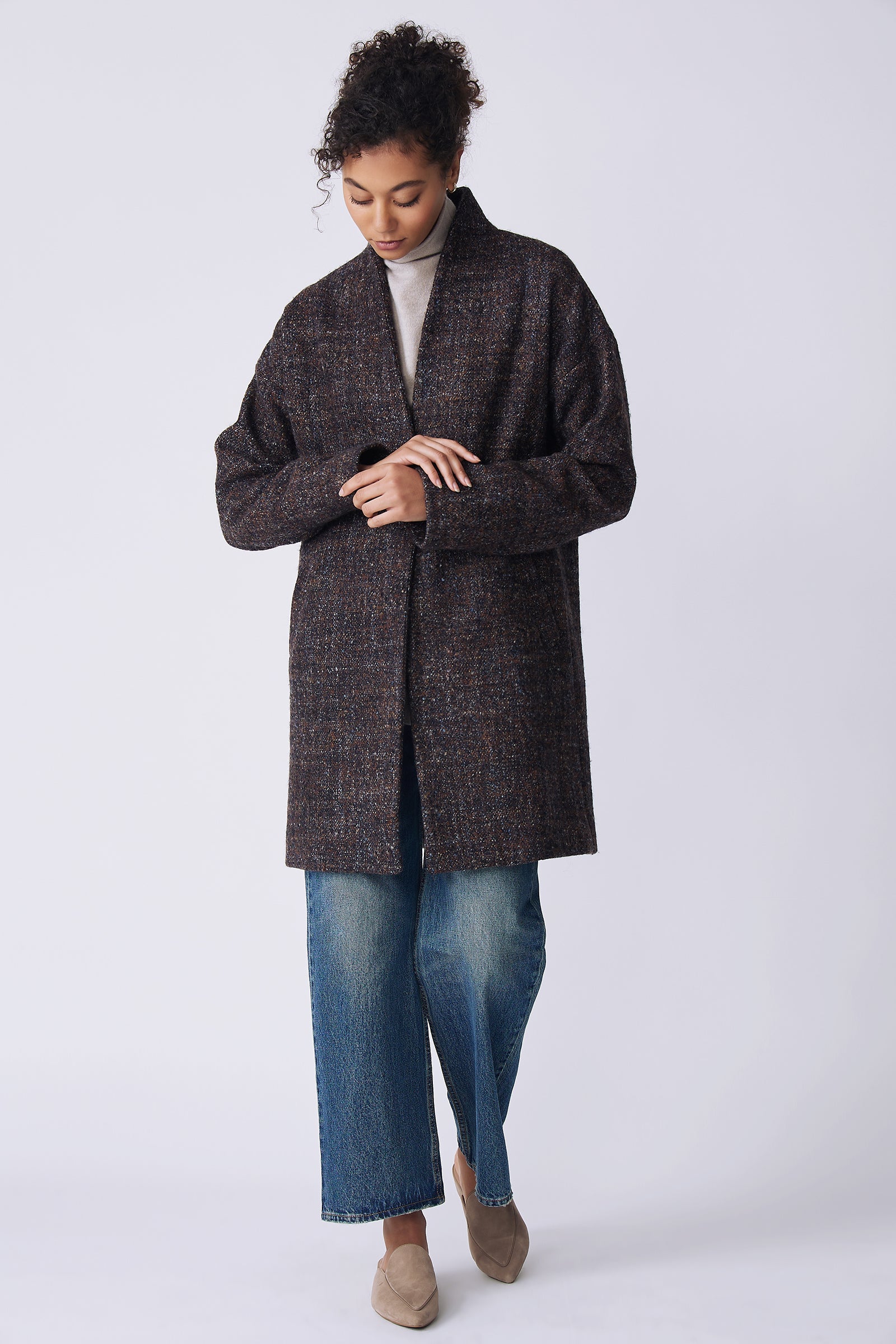 Kal Rieman Sloan Coat in multi on model front view walking hands holding cuff