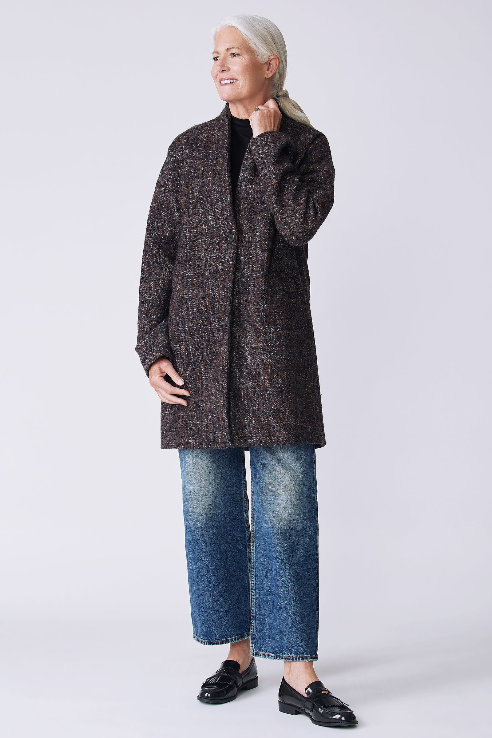 Kal Rieman Sloan Coat in multi on model side view holding collar