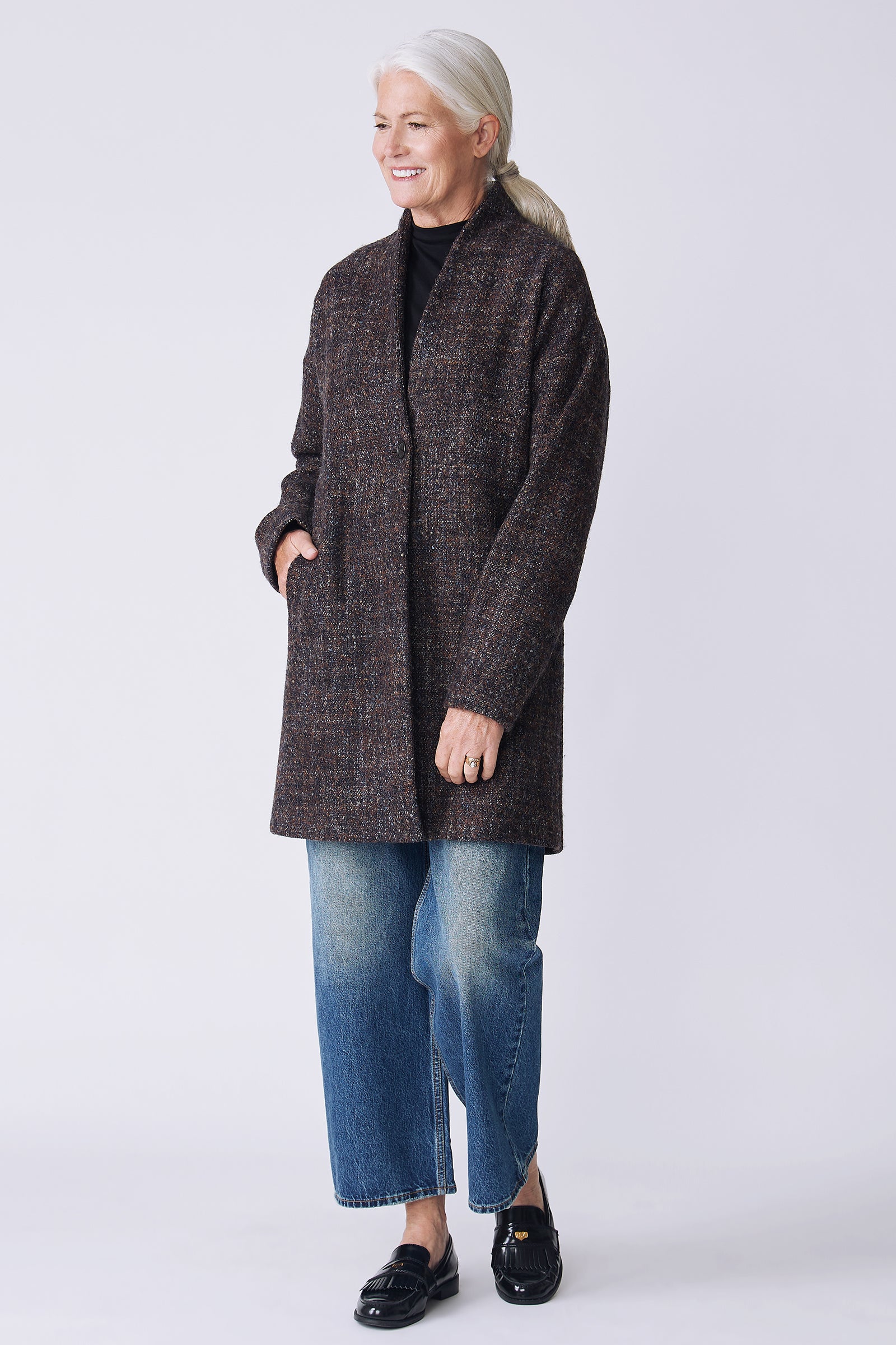 Kal Rieman Sloan Coat in multi on model side view walking